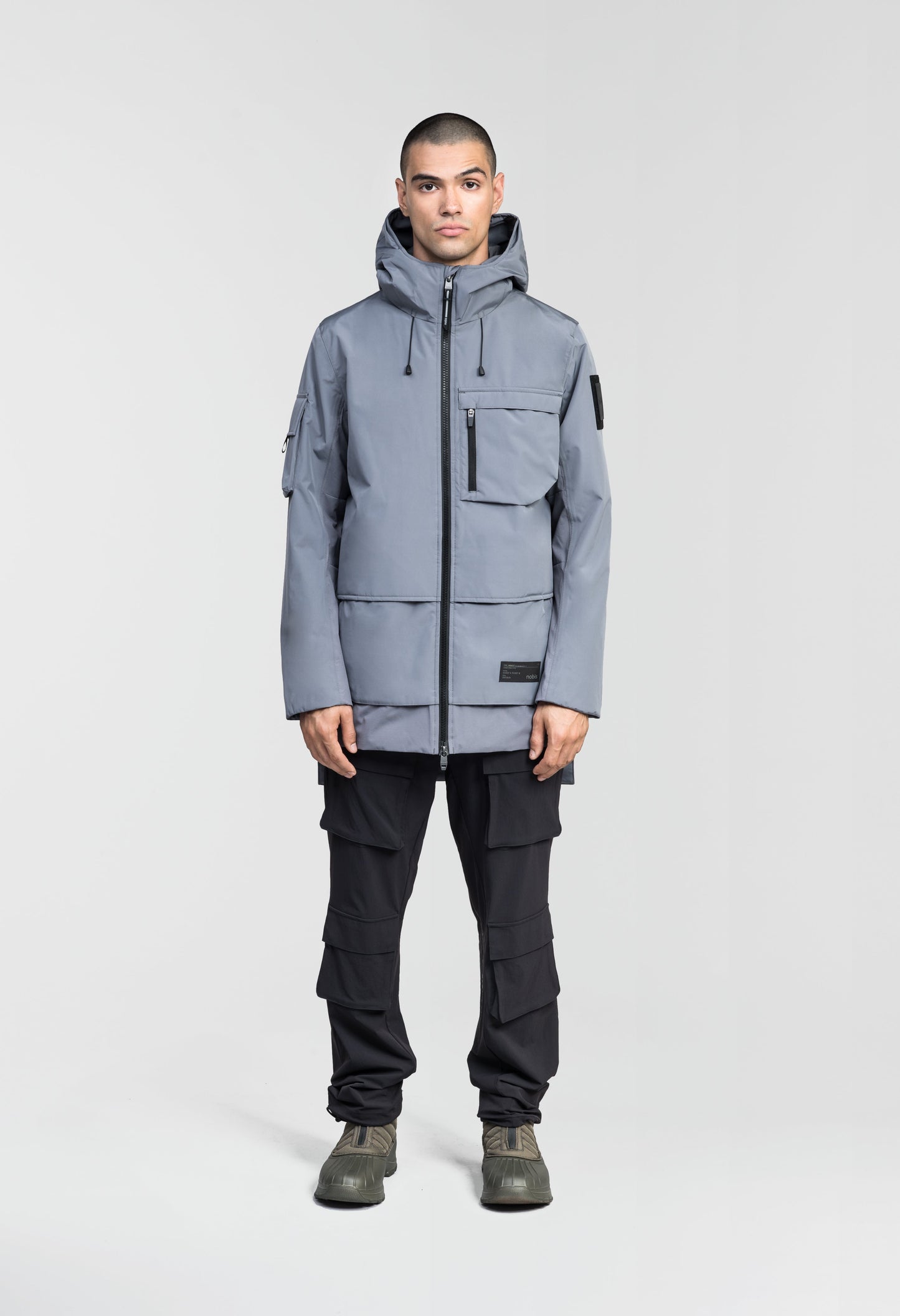 Alta Men's Performance Shell Jacket in hip length, Primaloft Gold Insulation Active+, chest and waist pockets, ventilation under arms, reflective detailing on hood and back, two-way front zipper, and non-removable hood with adjustable drawstrings, in Concrete