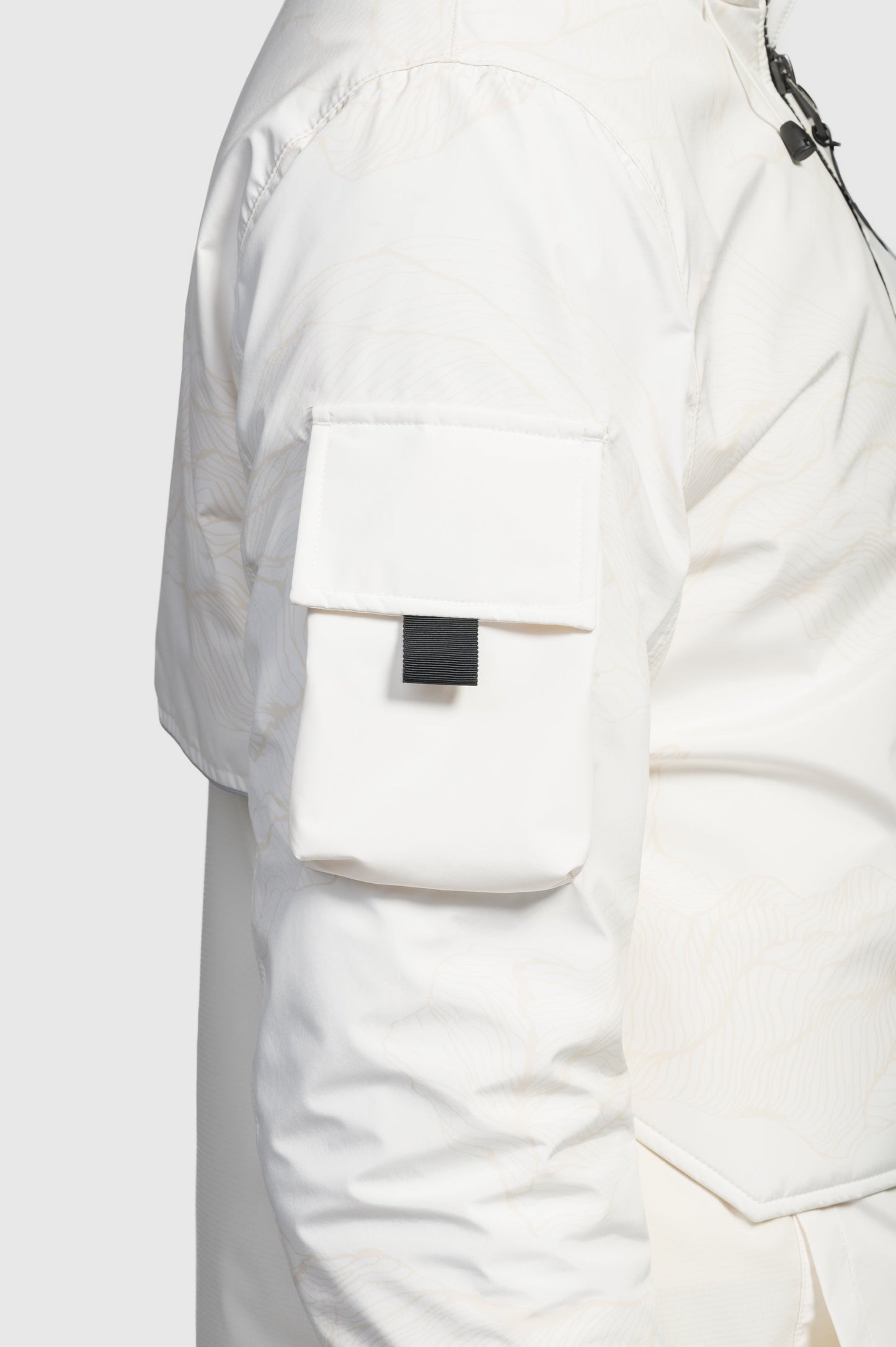 Alta Men's Performance Shell Jacket in hip length, Primaloft Gold Insulation Active+, chest and waist pockets, ventilation under arms, reflective detailing on hood and back, two-way front zipper, and non-removable hood with adjustable drawstrings, in Wheat Desert