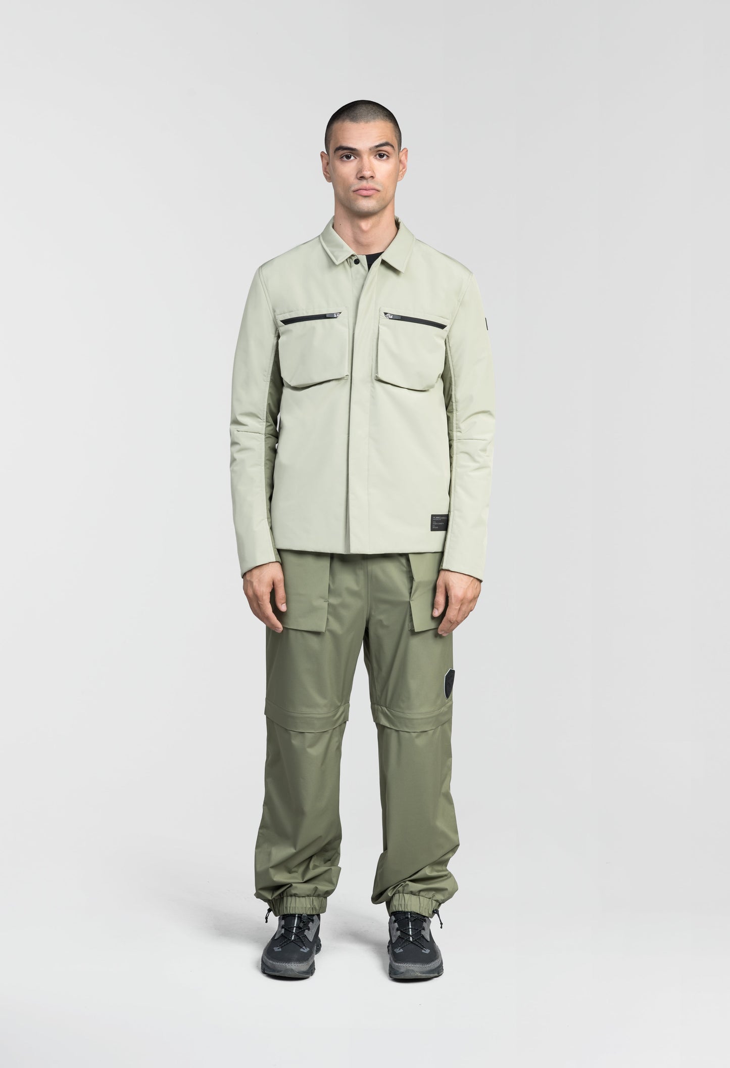 Ander Men's Mid Layer Shirt in hip length, PrimaLoft Gold Insulation Active+, 3-Ply Micro Denier front and 4-Way Durable Stretch Weave back, zipper chest pockets, snap button wind flap, and snap button cuffs, in Tea/Clover