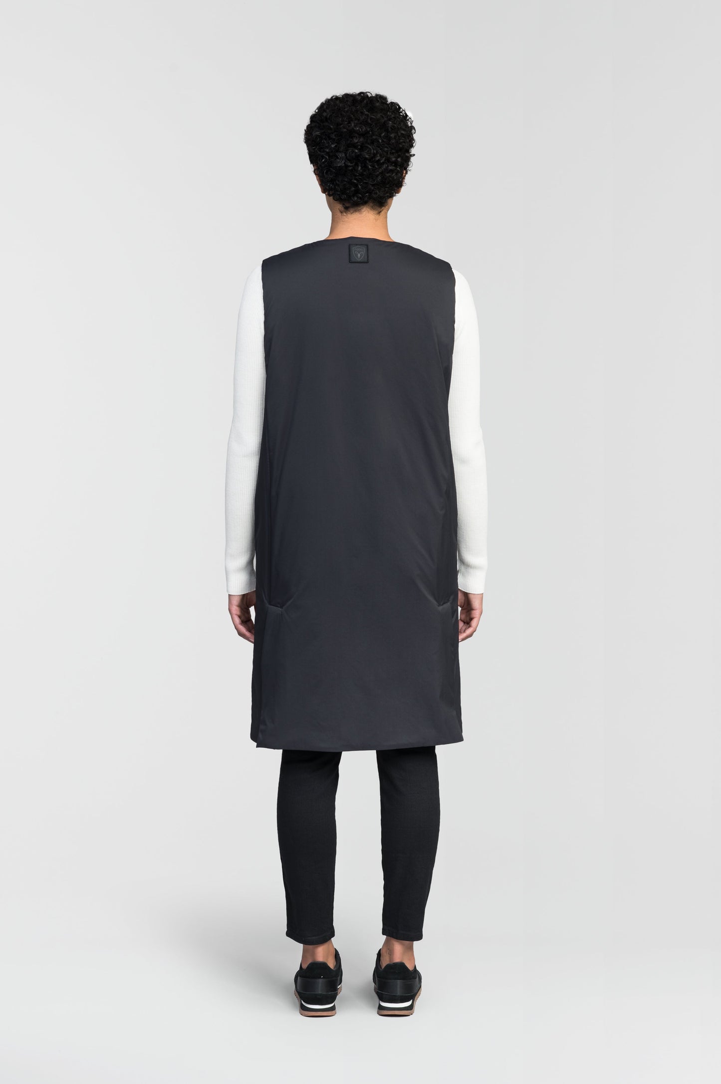 Brexton Women's Tailored Long Mid Layer Vest in knee length, centre front wind flap, flap closure waist pocket with additional side entry storage, single vent on back bottom hem, in Black