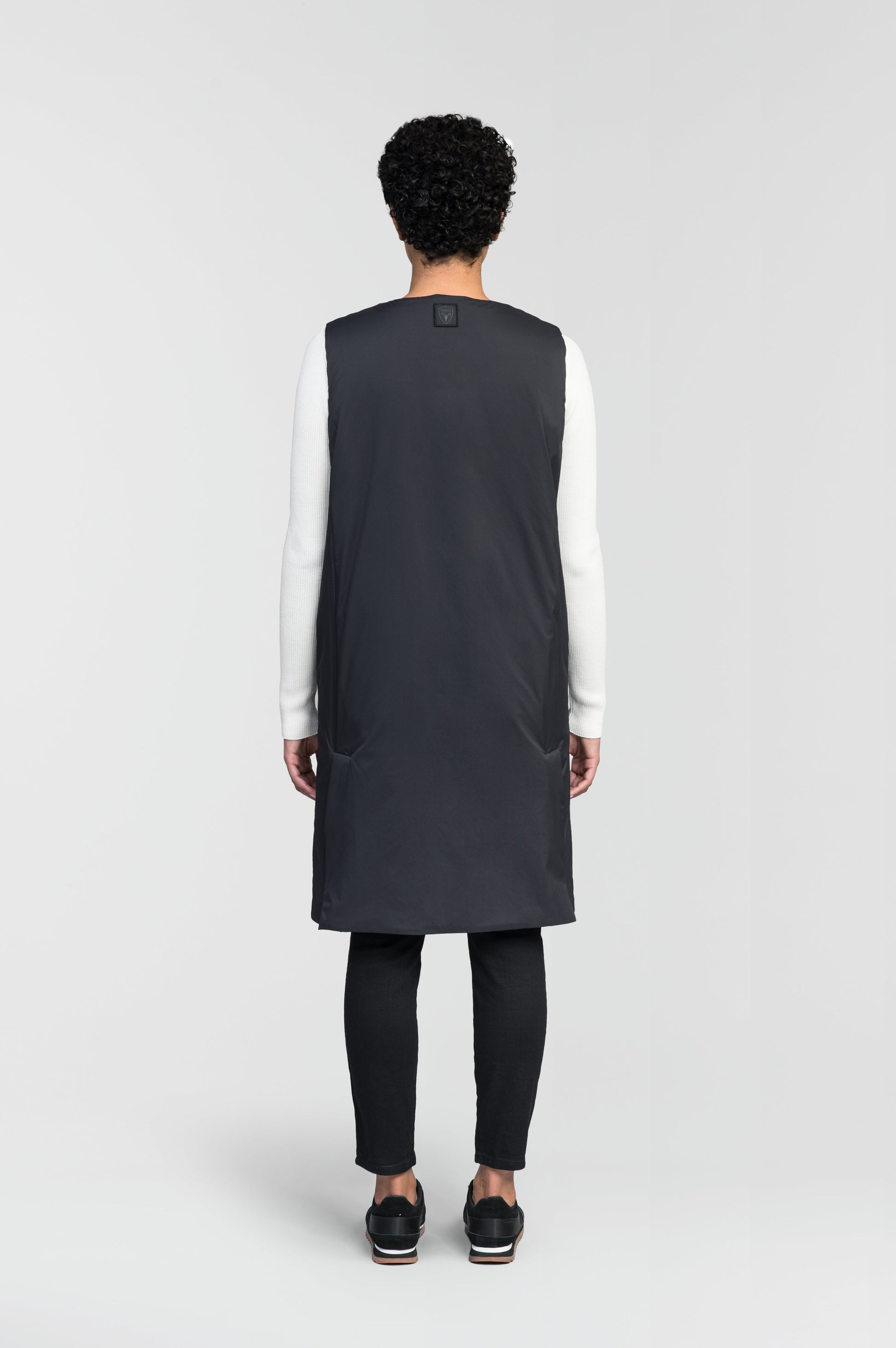 Brexton Women's Tailored Long Mid Layer Vest in knee length, centre front wind flap, flap closure waist pocket with additional side entry storage, single vent on back bottom hem, in Black