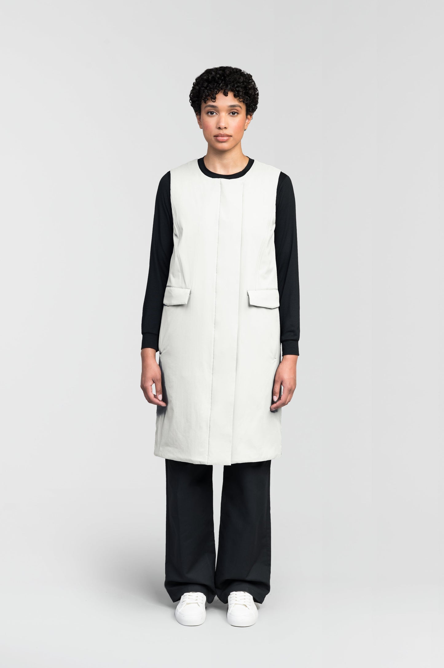 Brexton Women's Tailored Long Mid Layer Vest in knee length, centre front wind flap, flap closure waist pocket with additional side entry storage, single vent on back bottom hem, in Chalk