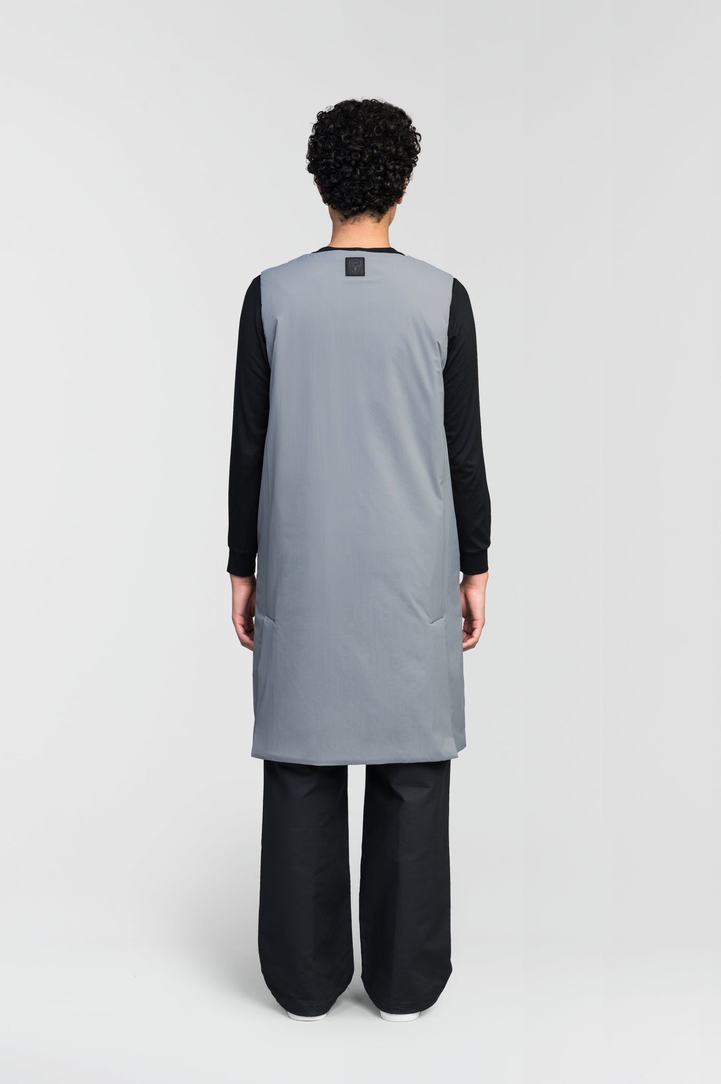 Brexton Women's Tailored Long Mid Layer Vest in knee length, centre front wind flap, flap closure waist pocket with additional side entry storage, single vent on back bottom hem, in Concrete