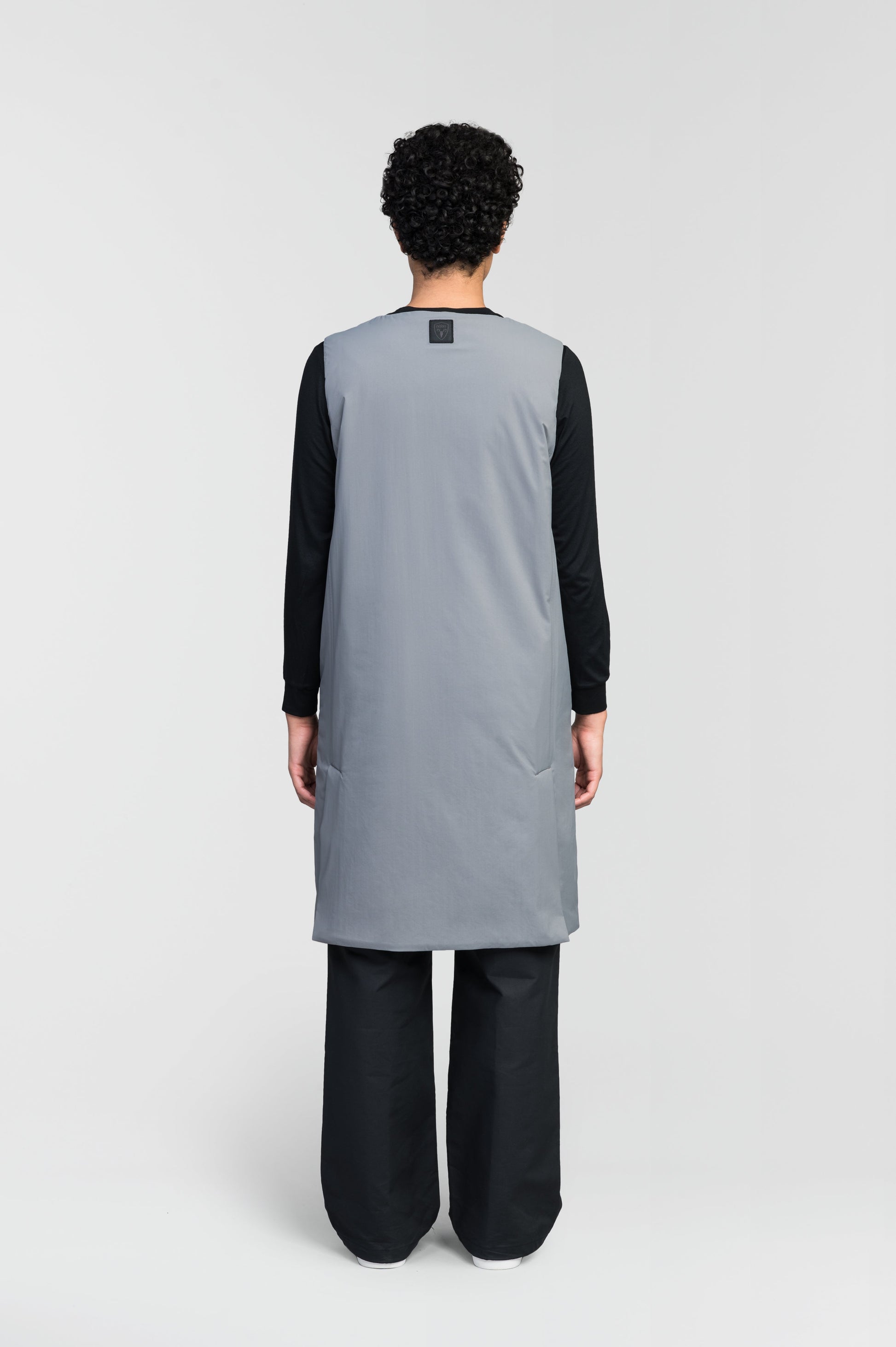 Brexton Women's Tailored Long Mid Layer Vest in knee length, centre front wind flap, flap closure waist pocket with additional side entry storage, single vent on back bottom hem, in Concrete