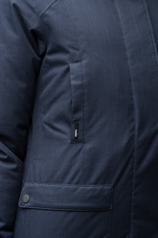 Women's down filled parka that sits just below the hip with a clean look and two hip patch pockets in Navy