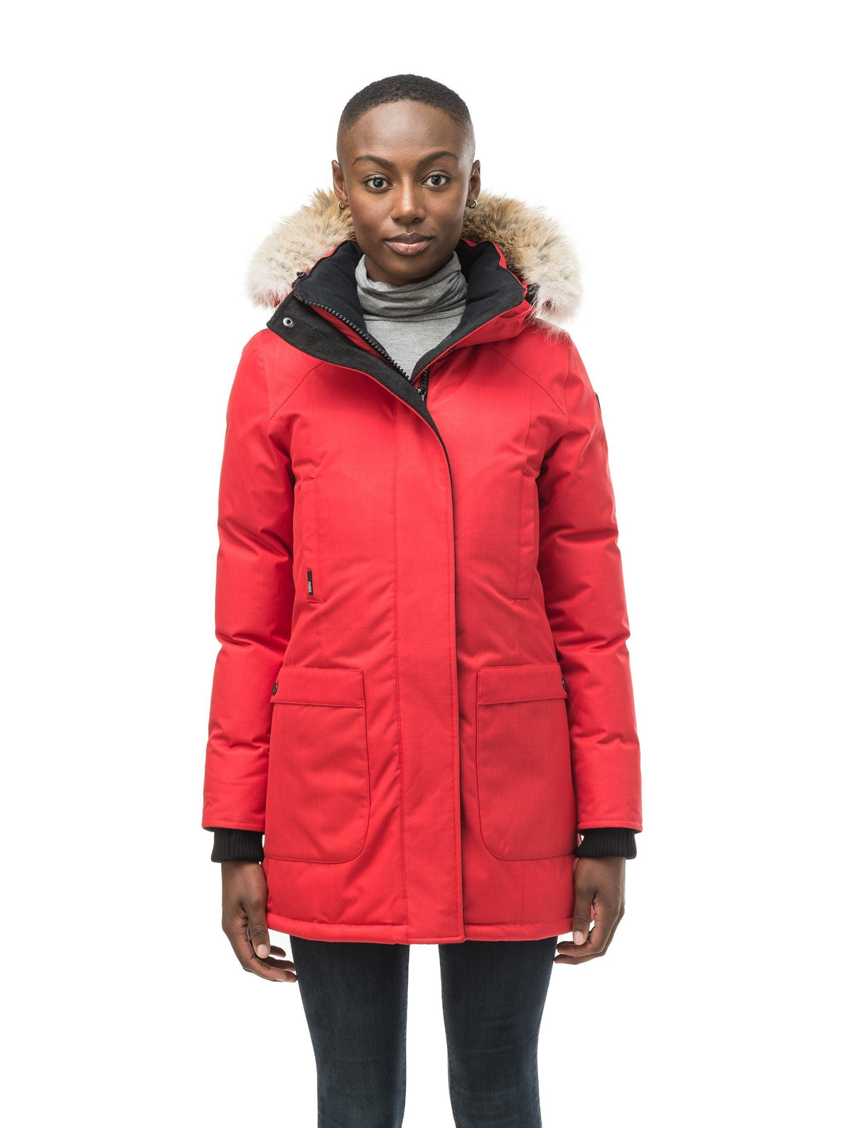 Women's down filled parka that sits just below the hip with a clean look and two hip patch pockets in Red