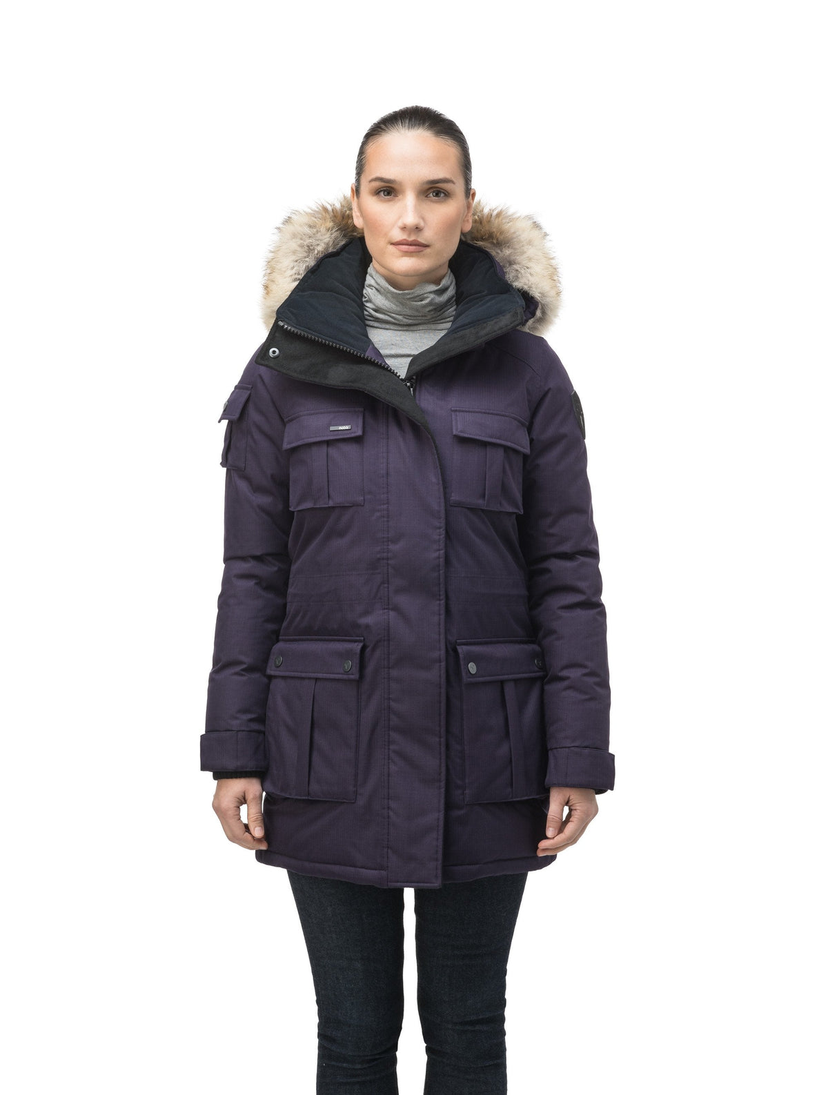 Women's down filled thigh length parka with four pleated patch pockets and an adjustable waist in Purple