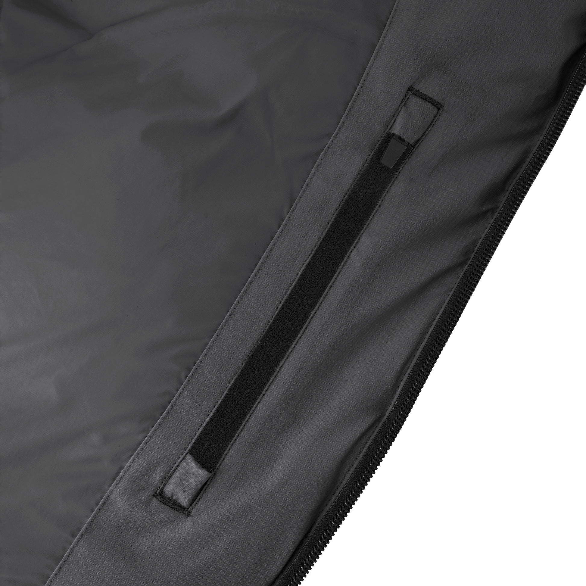 Dixon jacket in Black stretch ripstop fabric with DWR coating, large bellow pockets with magnetic flaps, hidden side-entry zipper pockets, and adjustable cuffs and hem for a tailored fit. Durable, weather-resistant, and versatile.