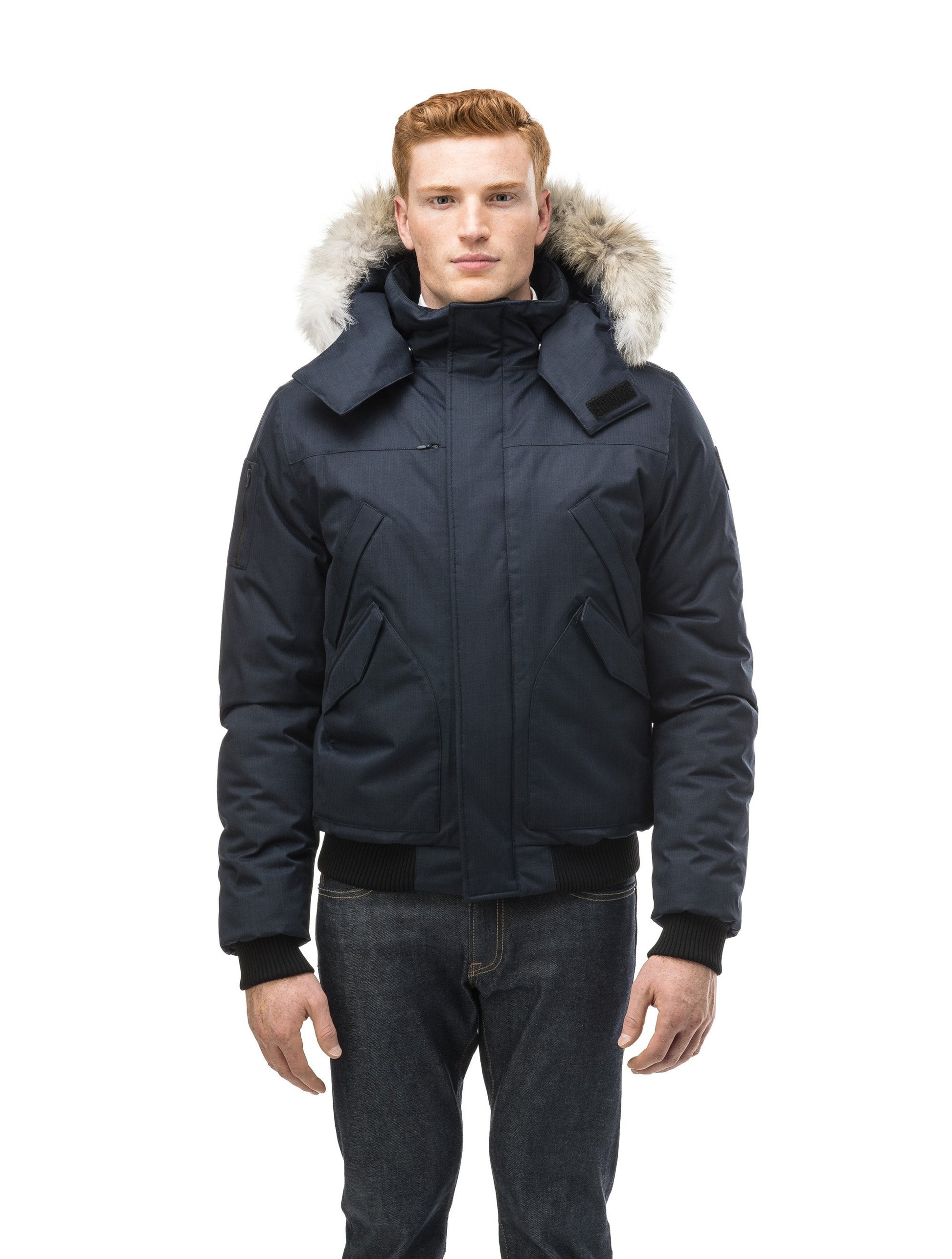 Men's classic down filled bomber jacket with a down filledÃƒÆ’Ã†â€™Ãƒâ€ Ã¢â‚¬â„¢ÃƒÆ’Ã¢â‚¬Â ÃƒÂ¢Ã¢â€šÂ¬Ã¢â€žÂ¢ÃƒÆ’Ã†â€™Ãƒâ€šÃ‚Â¢ÃƒÆ’Ã‚Â¢ÃƒÂ¢Ã¢â€šÂ¬Ã…Â¡Ãƒâ€šÃ‚Â¬ÃƒÆ’Ã¢â‚¬Â¦Ãƒâ€šÃ‚Â¡ÃƒÆ’Ã†â€™Ãƒâ€ Ã¢â‚¬â„¢ÃƒÆ’Ã‚Â¢ÃƒÂ¢Ã¢â‚¬Å¡Ã‚Â¬Ãƒâ€¦Ã‚Â¡ÃƒÆ’Ã†â€™ÃƒÂ¢Ã¢â€šÂ¬Ã…Â¡ÃƒÆ’Ã¢â‚¬Å¡Ãƒâ€šÃ‚Â hood that features a removable coyote fur trim and concealed moldable framing wire in Navy