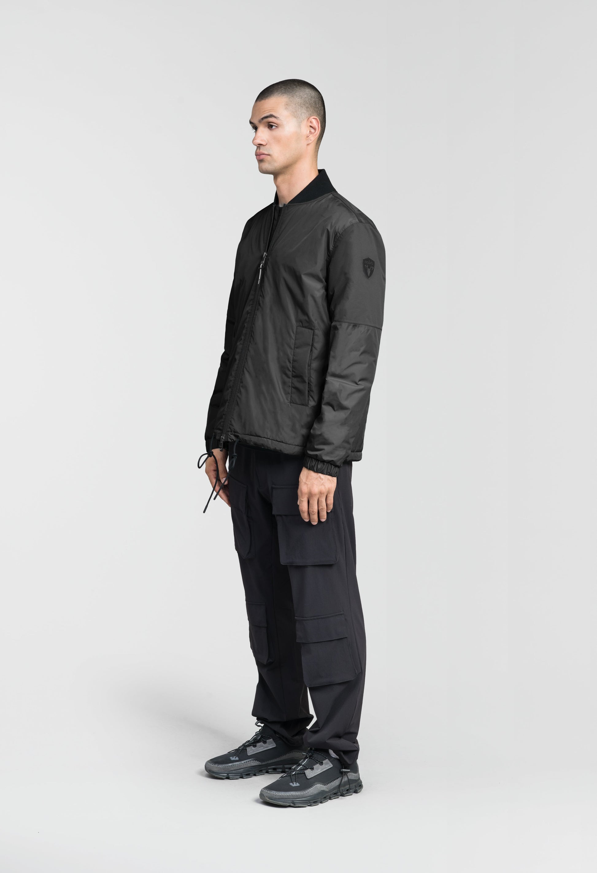 Edgemont Men's Tailored Coach Jacket in hip length, rib knit collar, elastic cuffs, centre front two-wau zipper, single welt waist pockets, adjustable waist drawstring, in Black