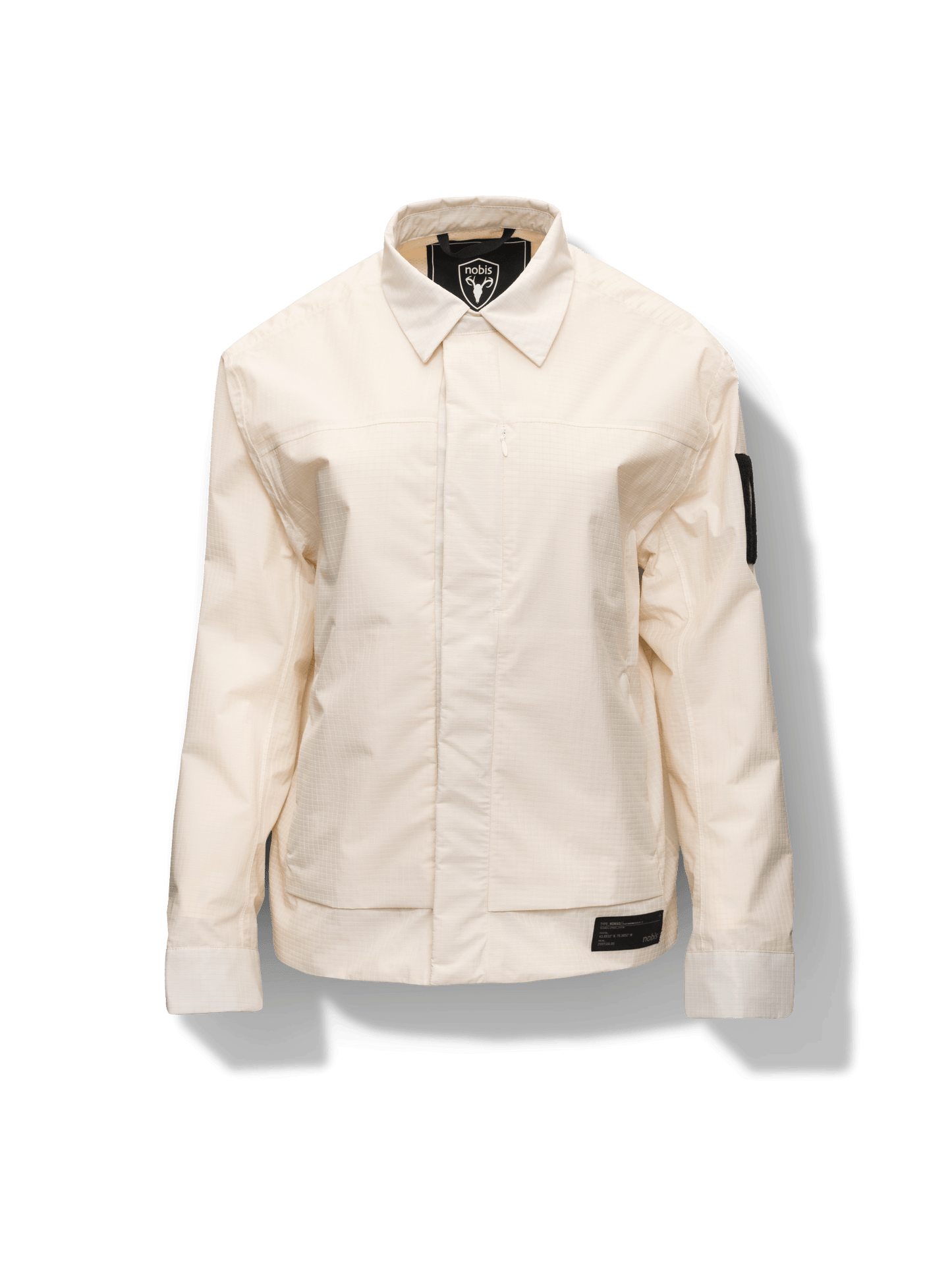 Farson Men's Waterproof Overshirt in Wheat made from premium recycled polyester ripstop with a DWR coating. Features a concealed snap-button front placket, adjustable snap cuffs, invisible chest zip pocket, dual zippered waist pockets, pit zip ventilation, and seam-sealed construction for enhanced weather protection. Designed in Canada.