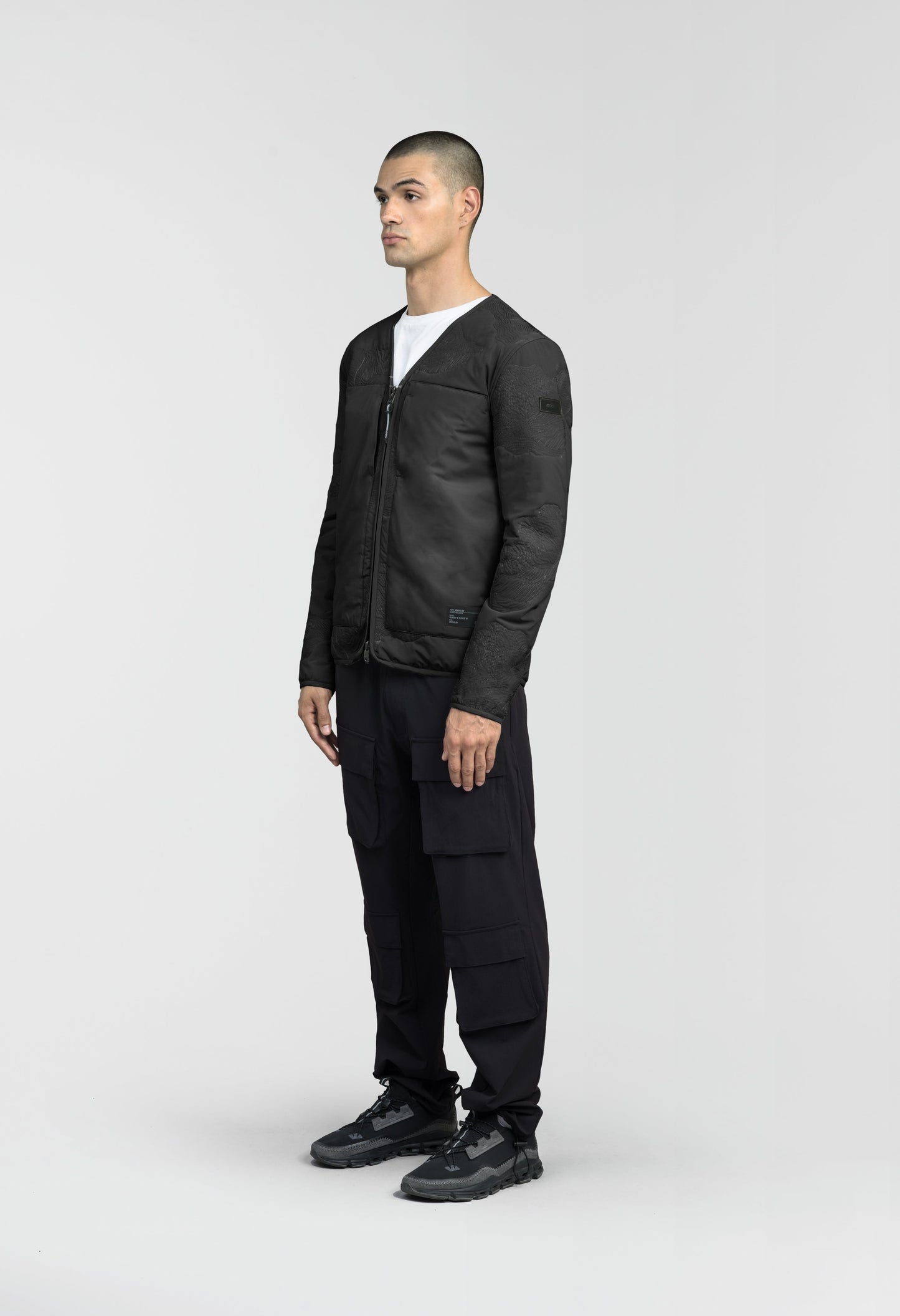 Gates Men's Performance Quilted V-Neck Jacket in hip length, centre front two-way zipper, hidden zipper chest pockets, side entry waist pockets, in Black