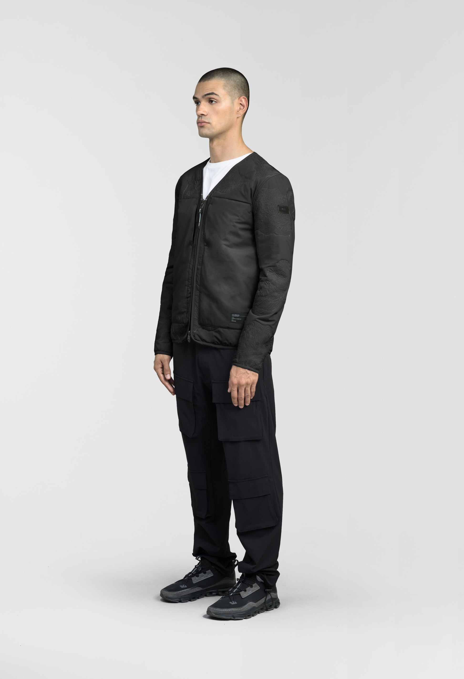 Gates Men's Performance Quilted V-Neck Jacket in hip length, centre front two-way zipper, hidden zipper chest pockets, side entry waist pockets, in Black