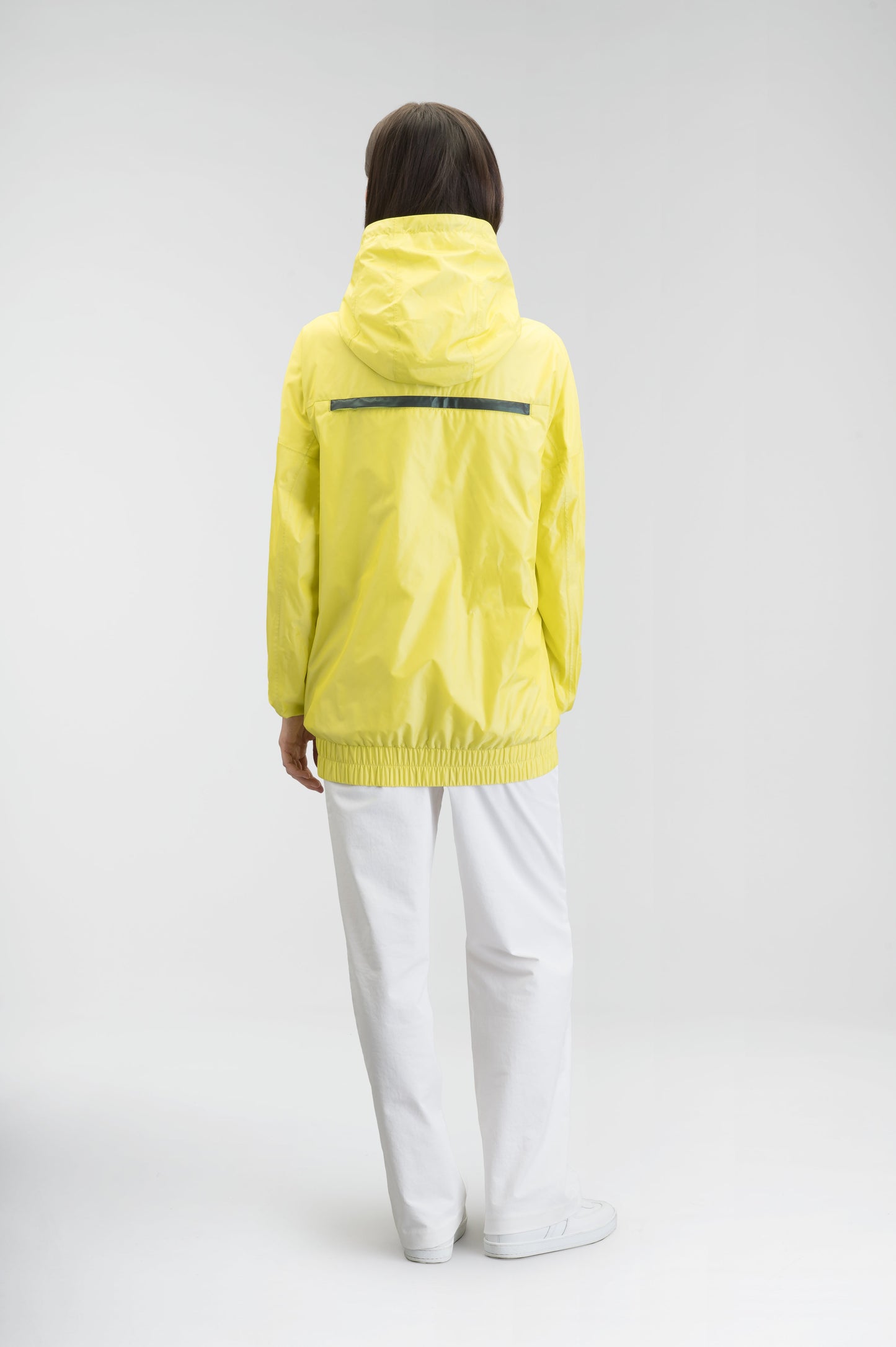 Hartley Women's Tailored Rain Jacket in hip length, two-way centre front zipper with wind flap, toggle adjustable cuffs and waist cord, non-removable hood, side entry waist pockets, in Sulphur Spring