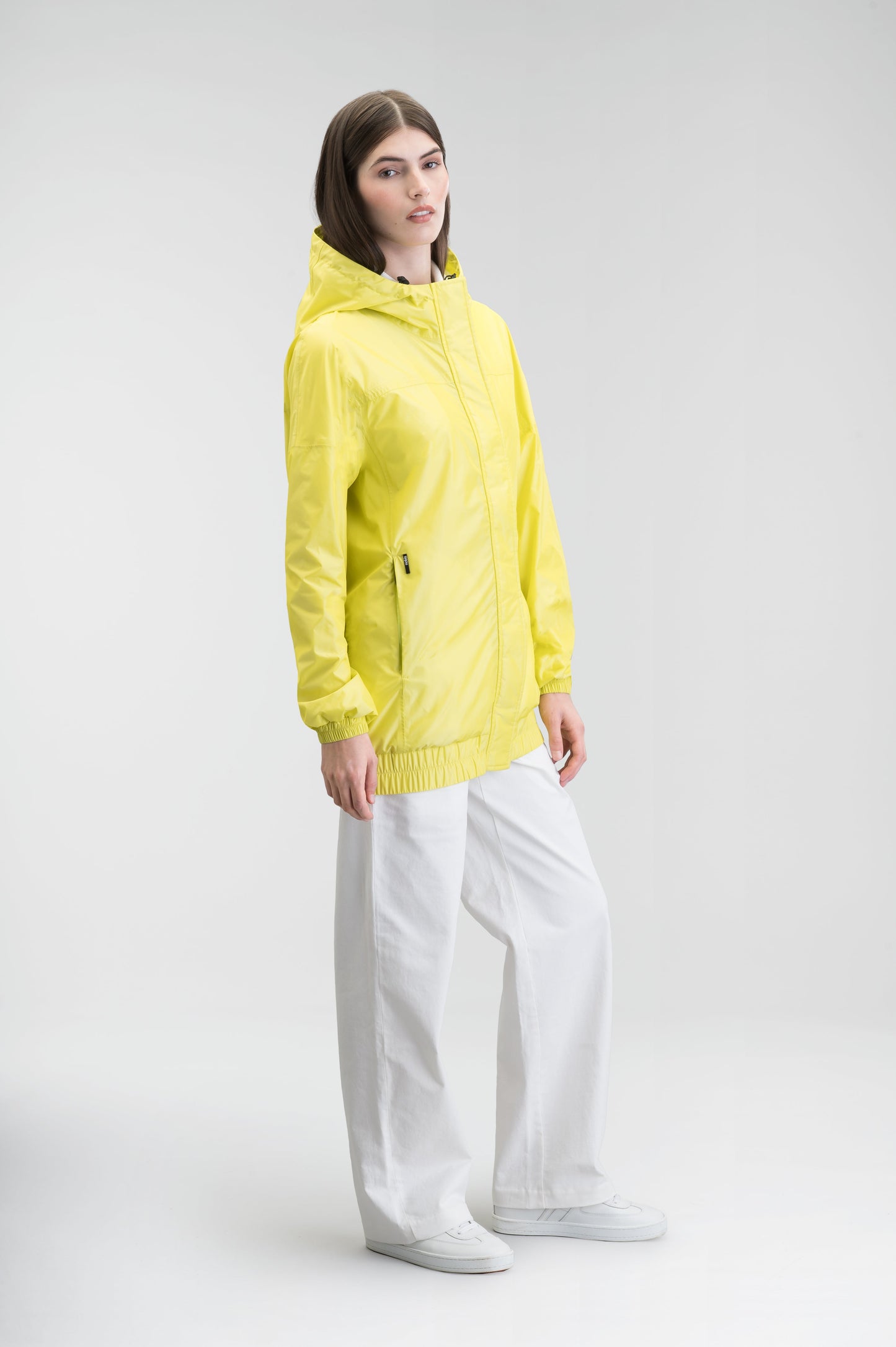 Hartley Women's Tailored Rain Jacket in hip length, two-way centre front zipper with wind flap, toggle adjustable cuffs and waist cord, non-removable hood, side entry waist pockets, in Sulphur Spring