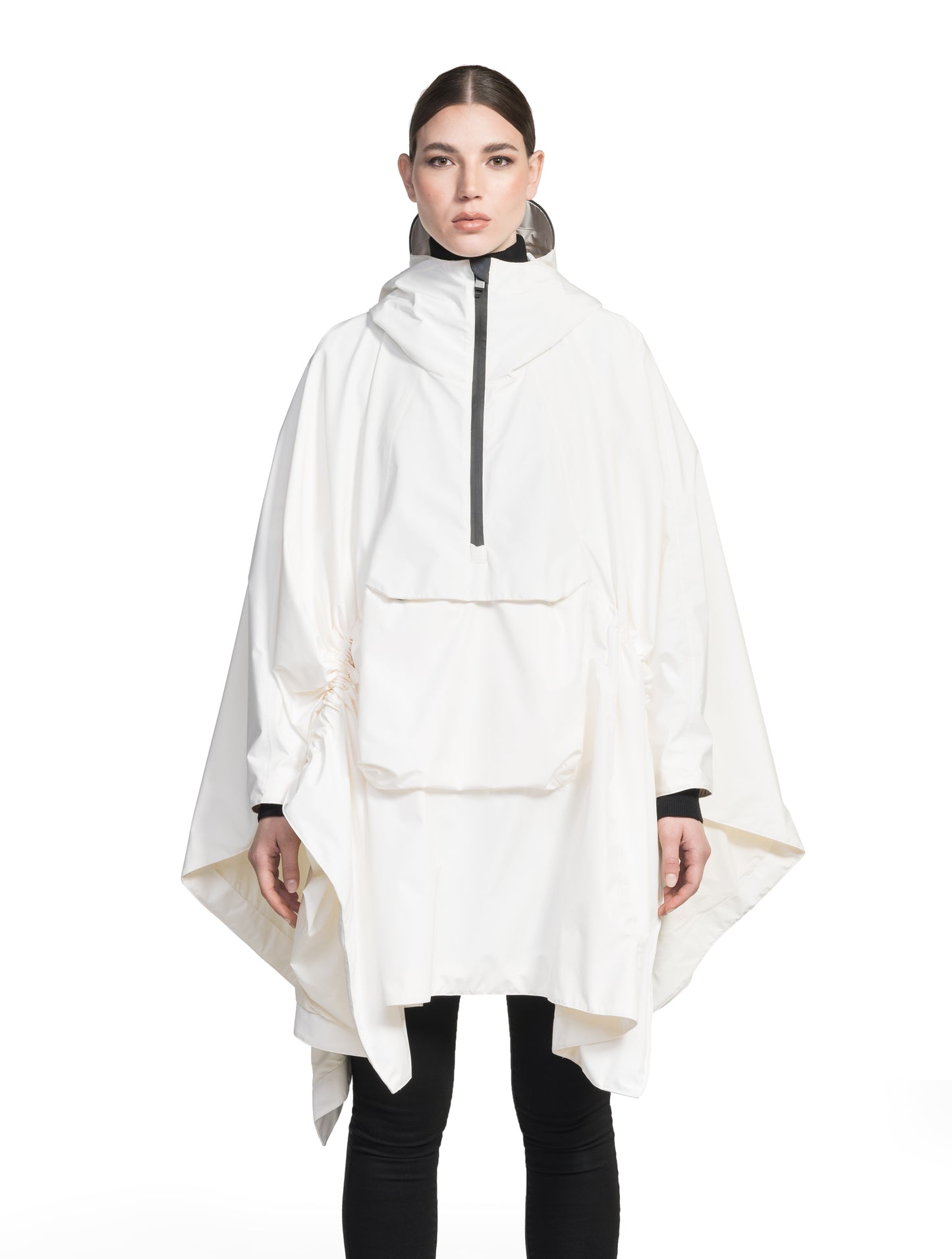 Hydra Unisex Performance Poncho in thigh length, non-removable hood, vertical half-zipper along centre front collar, hidden side-entry waist zipper pockets, adjustable webbing straps and snap closure cuffs, and packable to front kangaroo pocket with flap opening, in Chalk