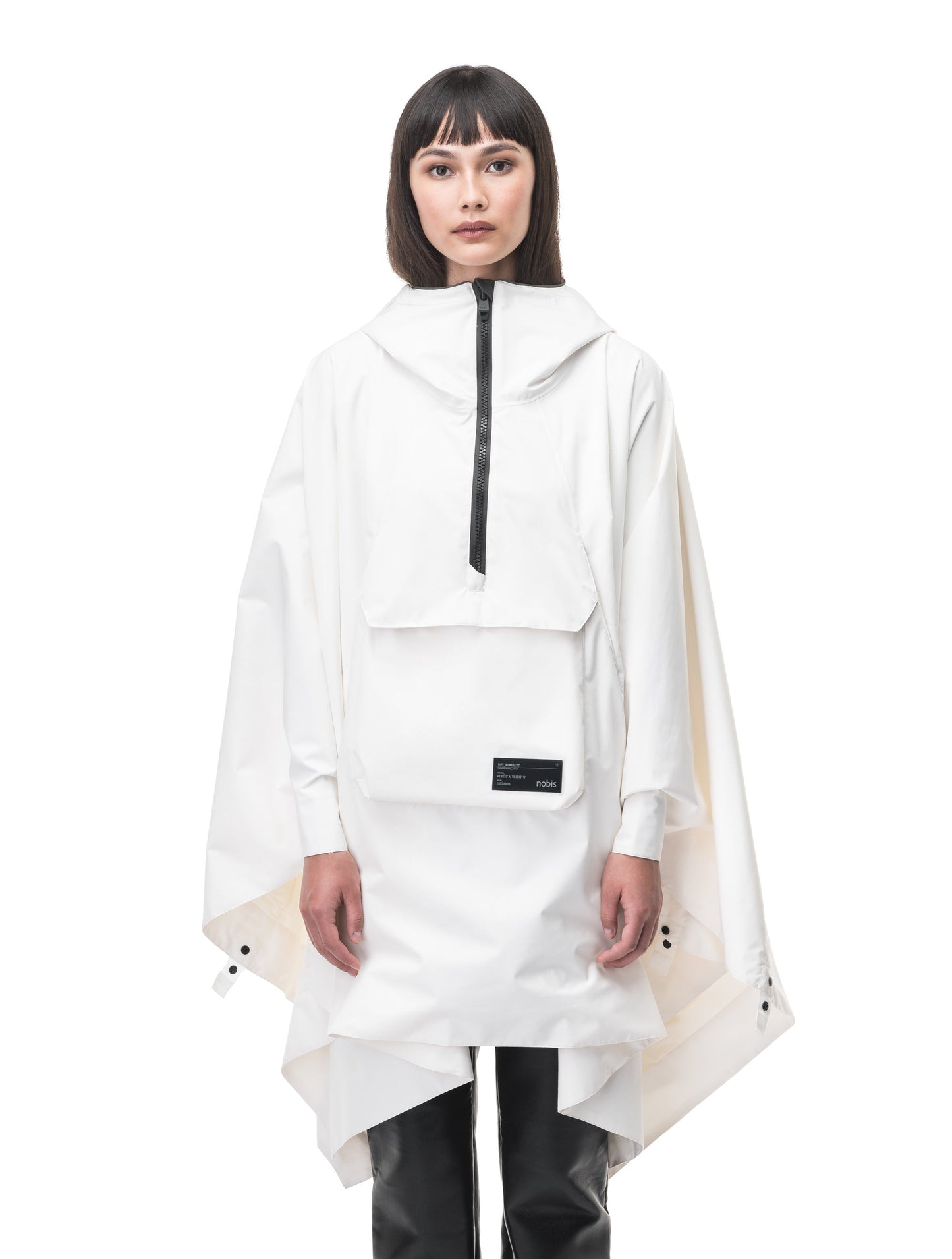 Hydra Unisex Performance Poncho in thigh length, non-removable hood, vertical half-zipper along centre front collar, hidden side-entry waist zipper pockets, adjustable webbing straps and snap closure cuffs, and packable to front kangaroo pocket with flap opening, in Chalk