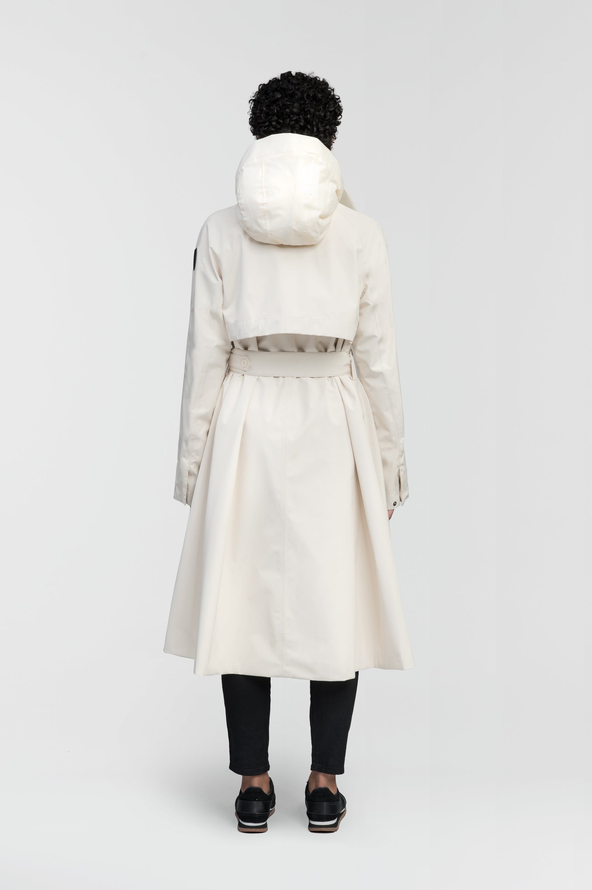 Ivy Ladies Tailored Trench Coat in knee length, 3-Ply Micro Denier fabrication, retractable non-removable hood, front wind flap with snap button closure, removable belt, and adjustable snap cuffs, in Wheat