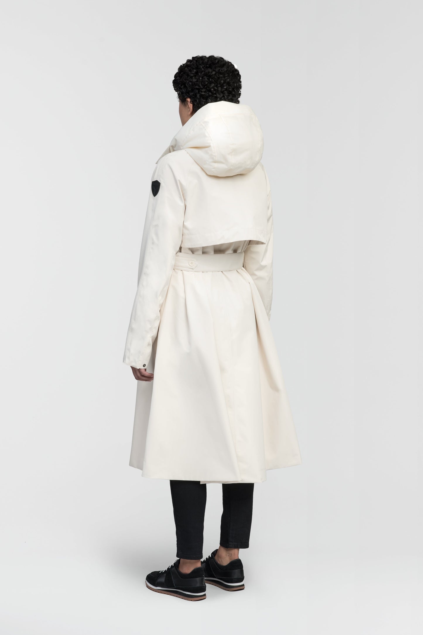 Ivy Ladies Tailored Trench Coat in knee length, 3-Ply Micro Denier fabrication, retractable non-removable hood, front wind flap with snap button closure, removable belt, and adjustable snap cuffs, in Wheat