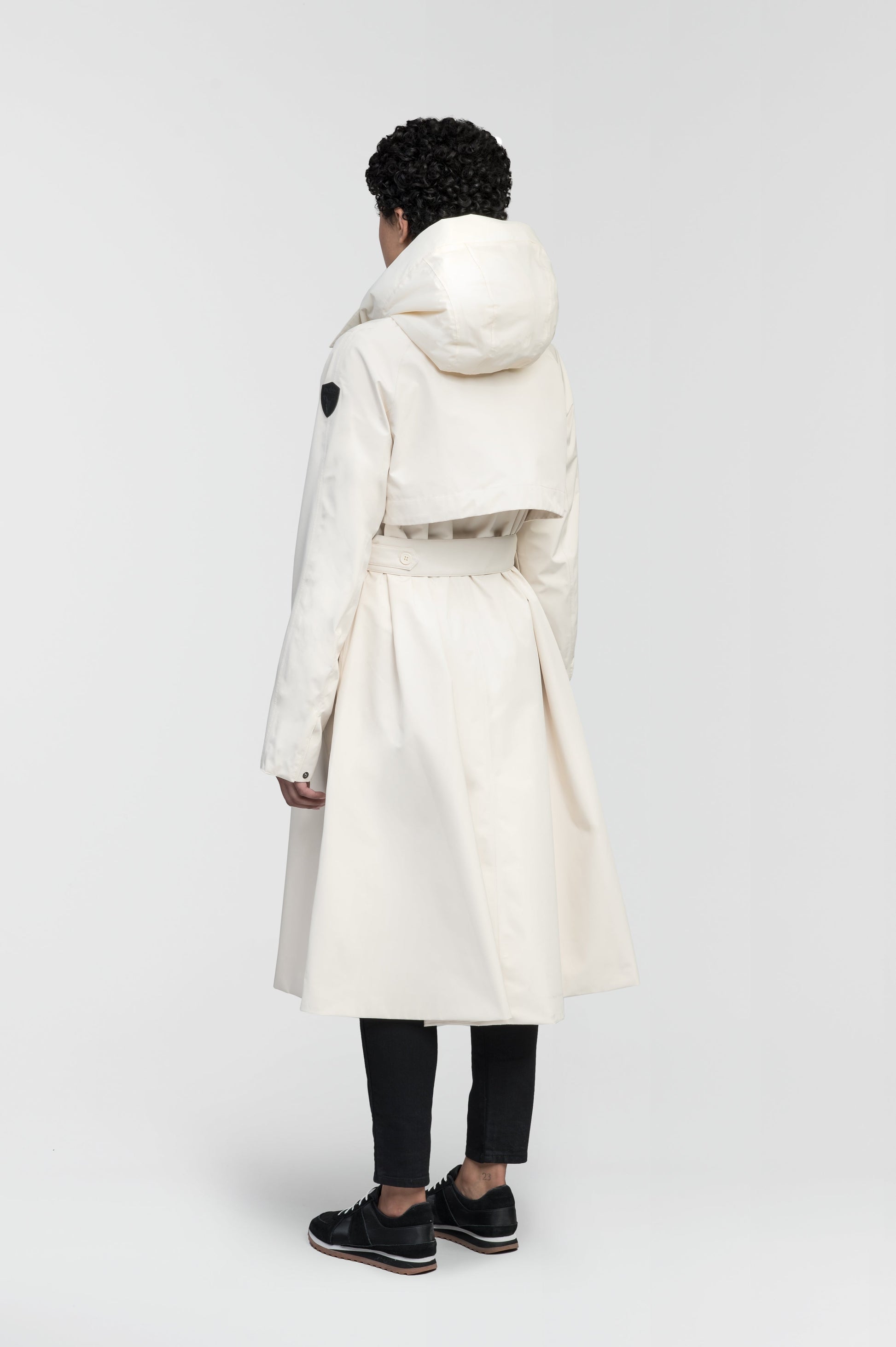 Ivy Ladies Tailored Trench Coat in knee length, 3-Ply Micro Denier fabrication, retractable non-removable hood, front wind flap with snap button closure, removable belt, and adjustable snap cuffs, in Wheat