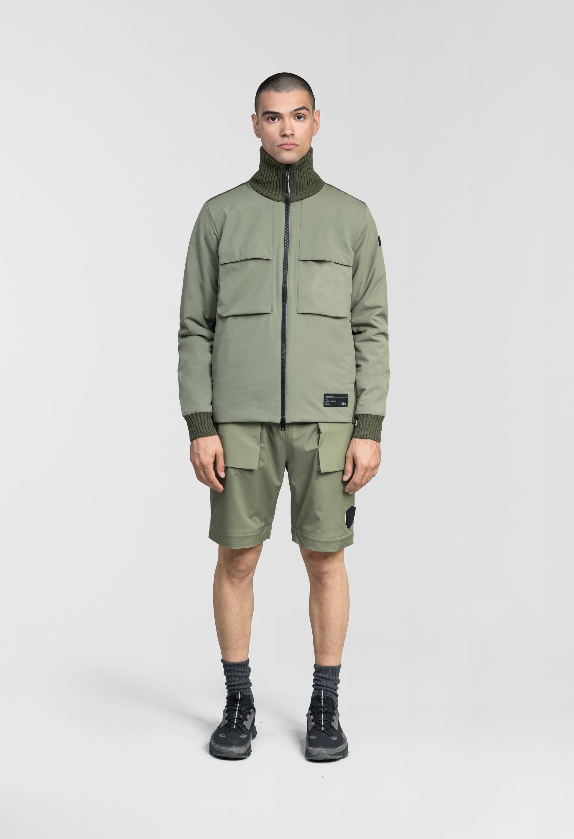 Layton Men's Tactical Hybrid Sweater in hip length, Primaloft Gold Insulation Active+, Merion wool knit collar, sleeves, back, and cuffs, two-way front zipper, and pockets at chest and waist, in Clover