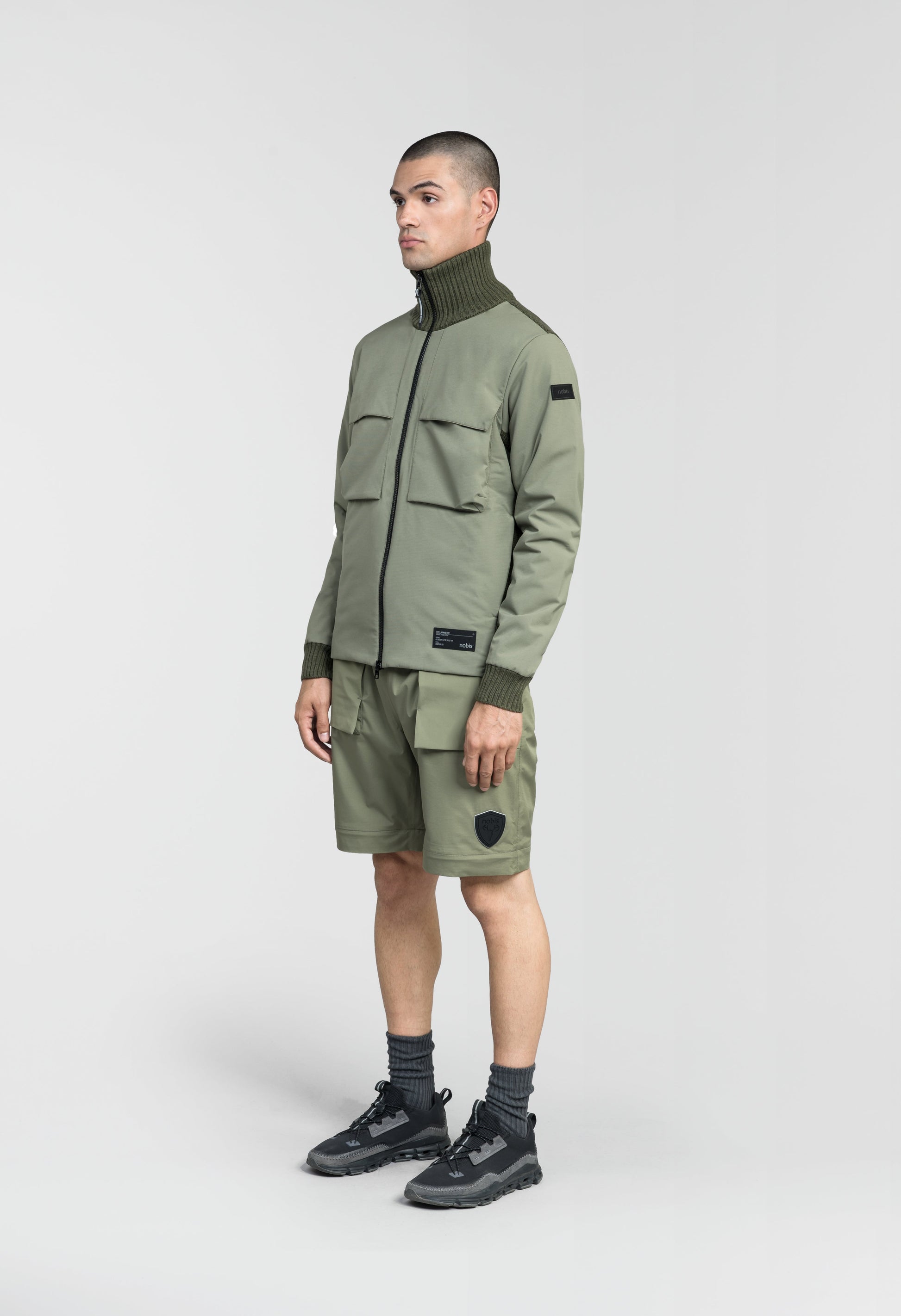 Layton Men's Tactical Hybrid Sweater in hip length, Primaloft Gold Insulation Active+, Merion wool knit collar, sleeves, back, and cuffs, two-way front zipper, and pockets at chest and waist, in Clover