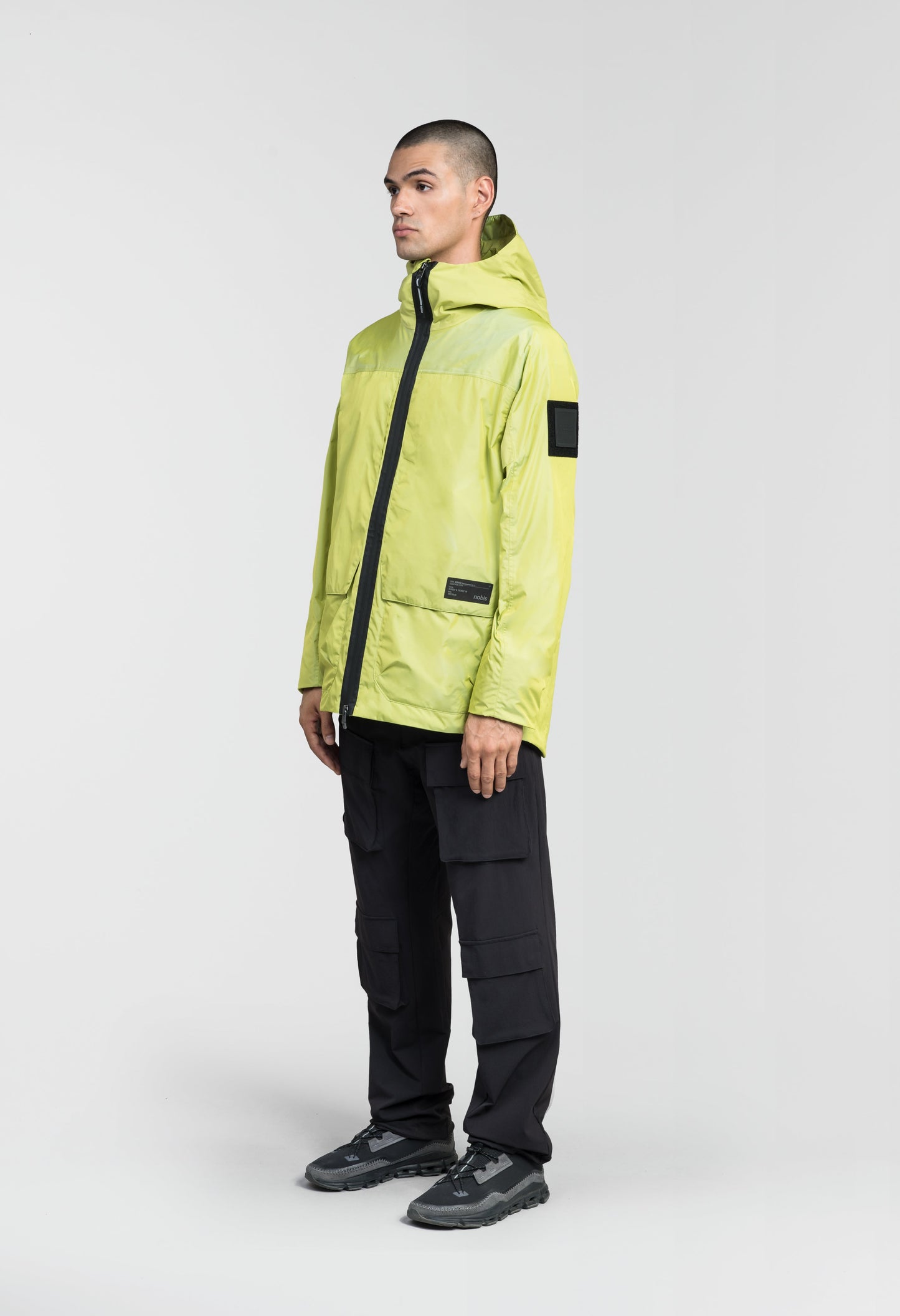 Mission Men's Performance Rain Shell Jacket in hip length, non-removable hood with adjustable toggle, two-way waterproof zipper, flap closure waist pockets with additional side entry storage, zipper ventilation on back, passive underarm ventilation, and breathable mesh lining, in Sulphur Spring