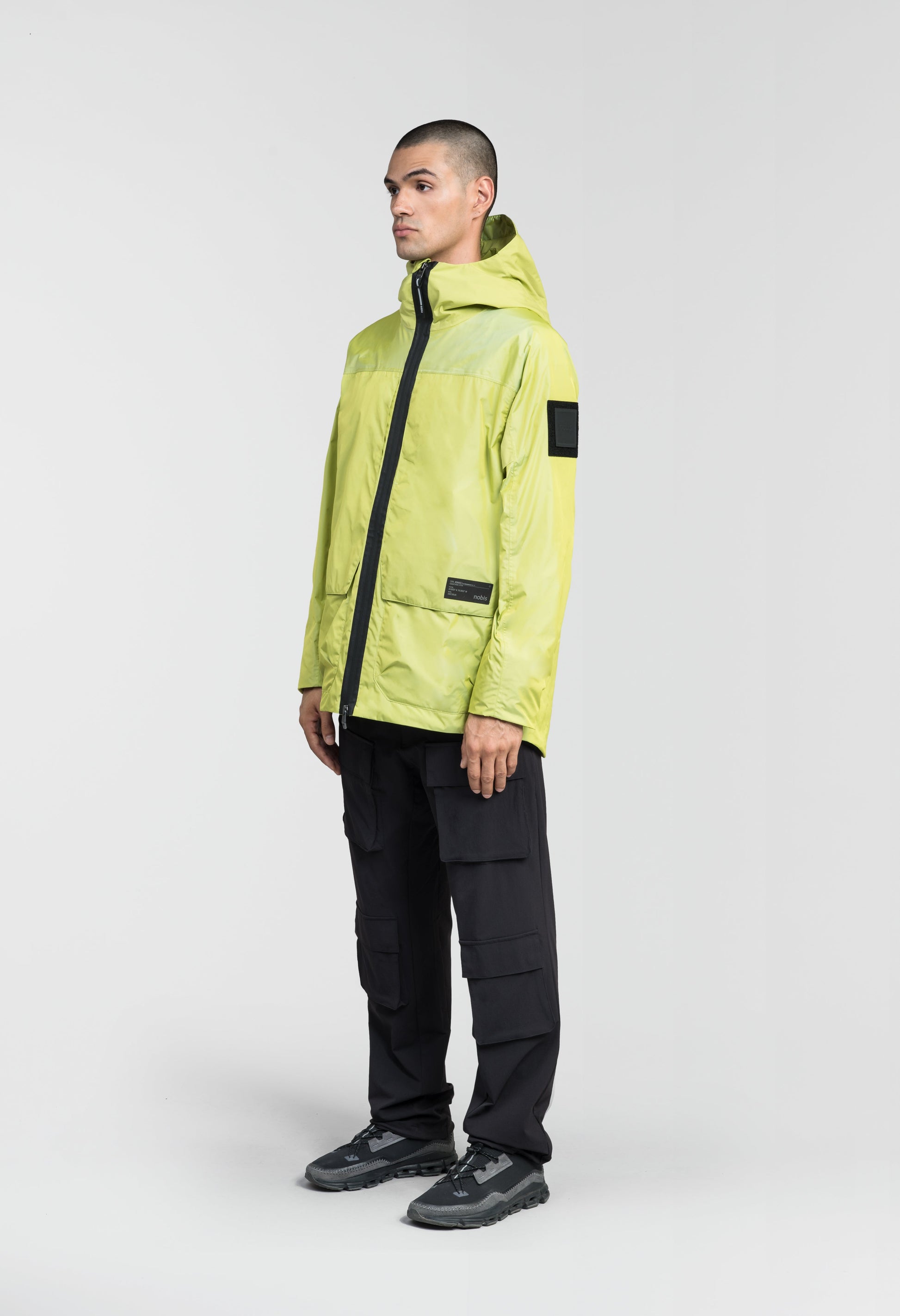 Mission Men's Performance Rain Shell Jacket in hip length, non-removable hood with adjustable toggle, two-way waterproof zipper, flap closure waist pockets with additional side entry storage, zipper ventilation on back, passive underarm ventilation, and breathable mesh lining, in Sulphur Spring