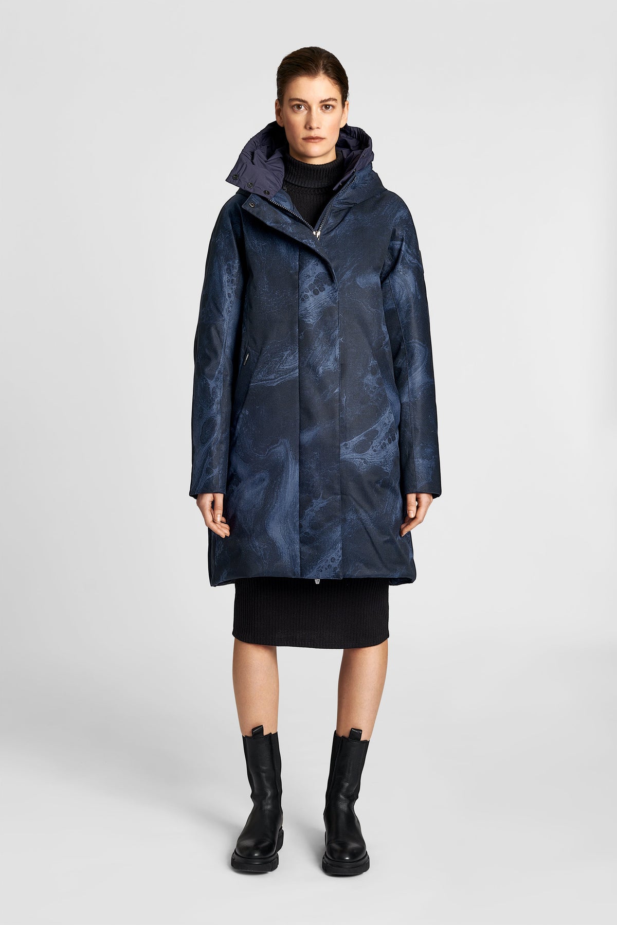 Dory Women's Tailored Back Zip Parka in knee length, premium Crosshatch fabrication, Premium Canadian White Duck Down insulation, non-removable down-filled hood, removable interior hood, centre front two-way zipper with wind flap, vertical zipper detailing along back, in Navy