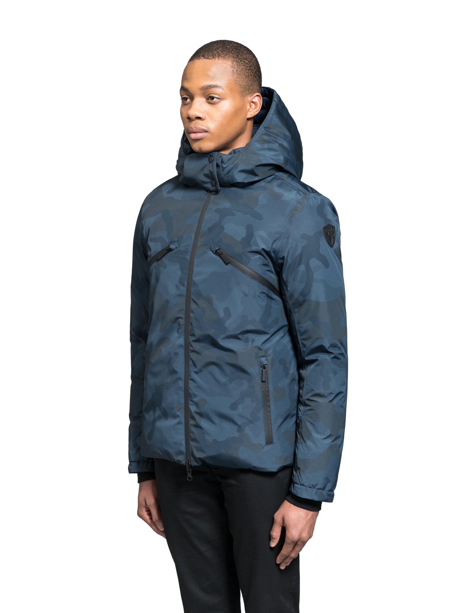 Hip length, reversible men's down filled jacket with removable hood in Navy Camo