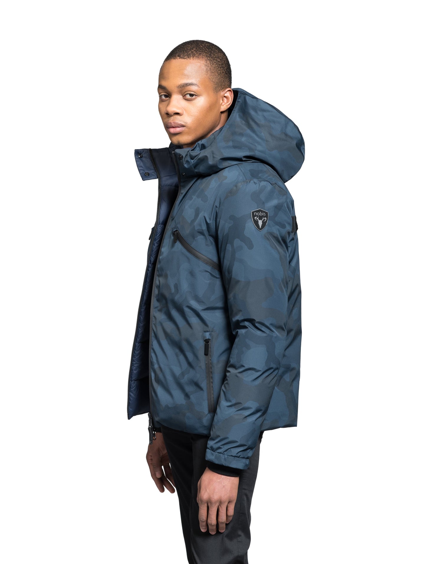 Hip length, reversible men's down filled jacket with removable hood in Navy Camo