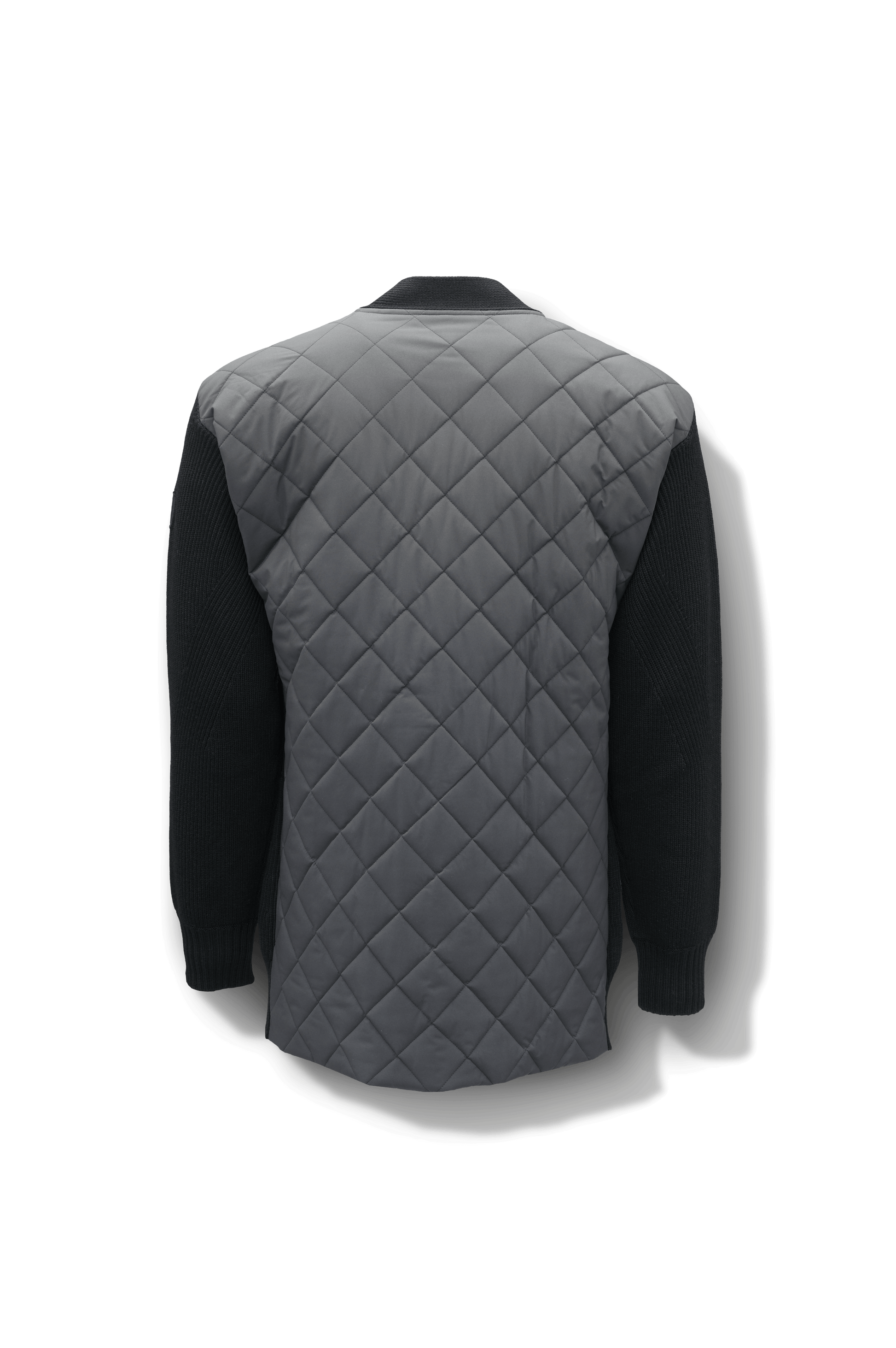 Riga Tailored Button Front Cardigan in thigh length, premium virgin extra fine merino wool knit and stretch ripstop fabrication, Primaloft Gold Insulation Active+, button-front closure, quilted back detailing, front waist pockets, in Black 