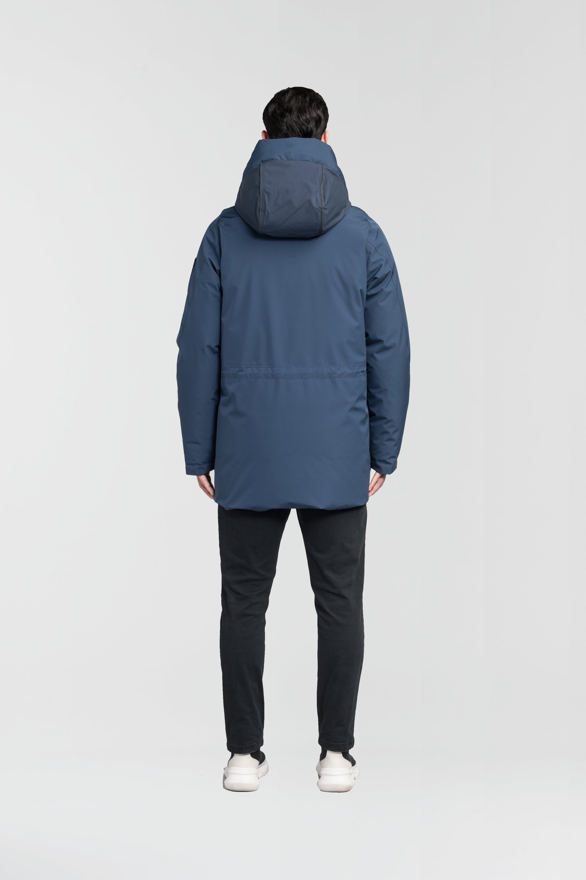 Ronin Men's Performance Utility Jacket in thigh length, premium 3-ply micro denier and stretch ripstop fabrication, Premium Canadian origin White Duck Down insulation, non-removable down-filled hood, bellow chest pockets, magnetic closure waist flap pockets, two-way centre-front zipper, pit zipper vents, hidden adjustable waist drawcord, in Marine