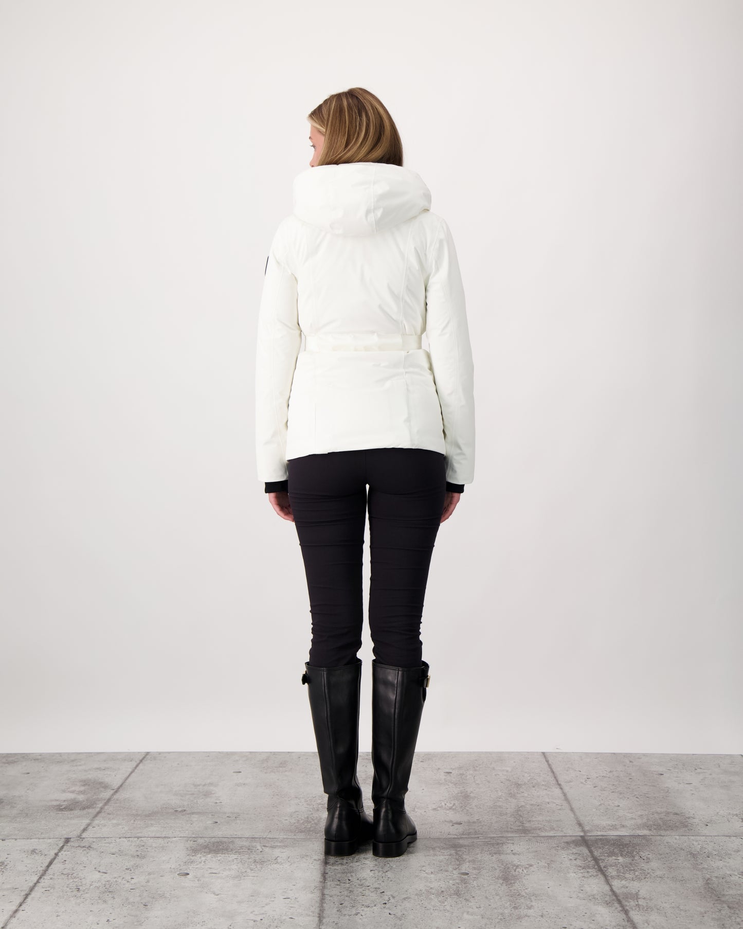 Ladies hip length down-filled parka with non-removable hood and adjustable belt in Chalk