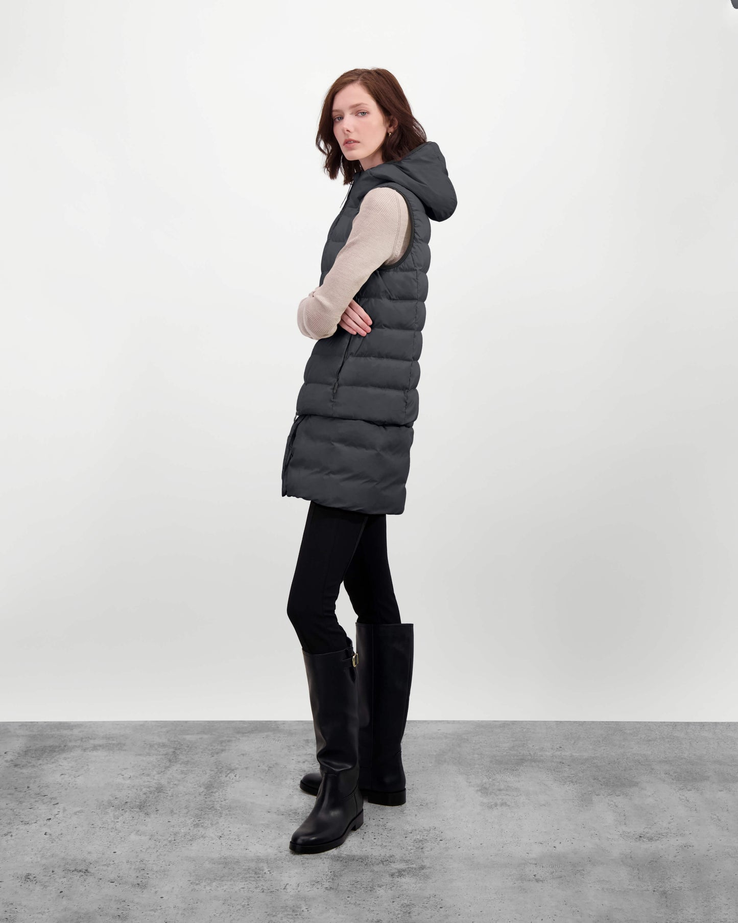 Saratoga puffer vest in Black insulated with Canadian white duck down, featuring stretch nylon ribbing for mobility, hidden waist drawcord, and a tailored fit for warmth and style. Lightweight and ideal for layering.