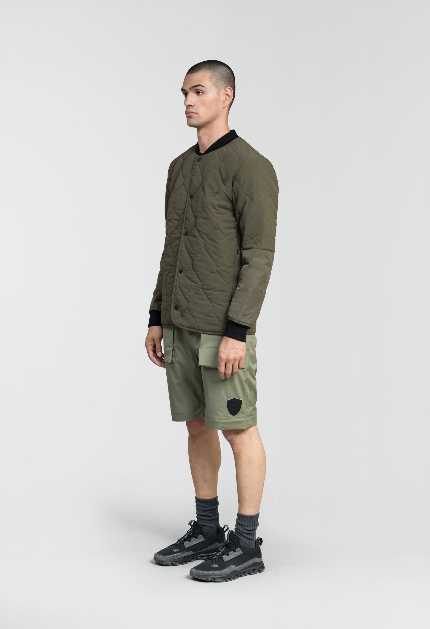 Speck Men's Tailored Mid Layer Jacket in hip length, Primaloft Gold Insulation Active+, diamond quilted body, rib knit collar and cuffs, snap buton front closure, and hidden side-entry zipper pockets at waist, in Fatigue