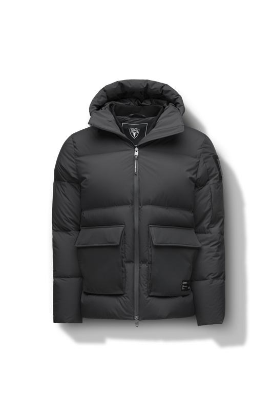 Supra Men's Performance Puffer in hip length, Technical Taffeta and 3-Ply Micro Denier fabrication, Premium Canadian White Duck Down insulation, non-removable down filled hood, centre front two-way zipper, flap pockets at waist, and zipper pocket at left bicep, in Black + Black
