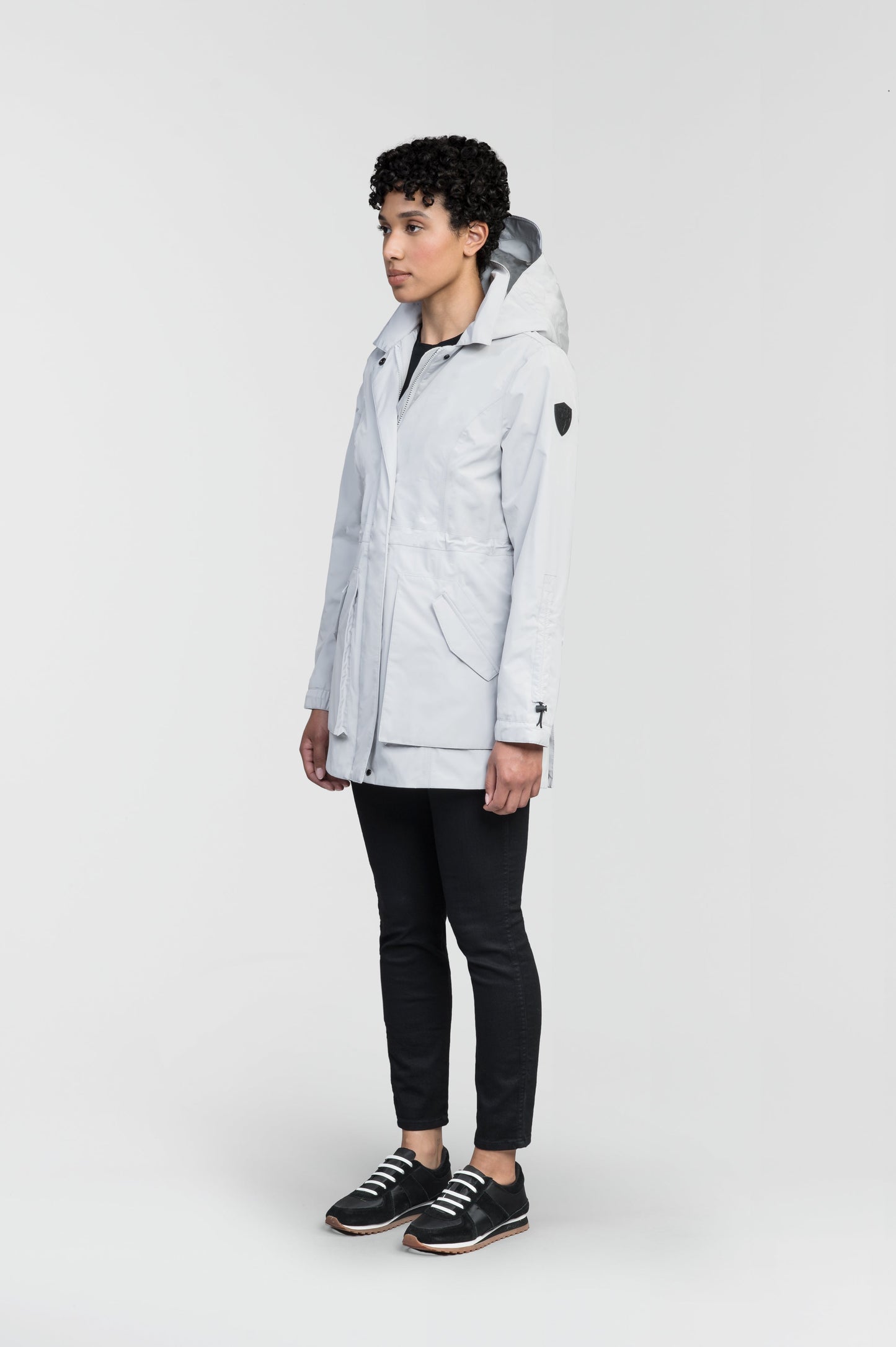Women's thigh length raincoat with collar and non-removable hood in Light Grey