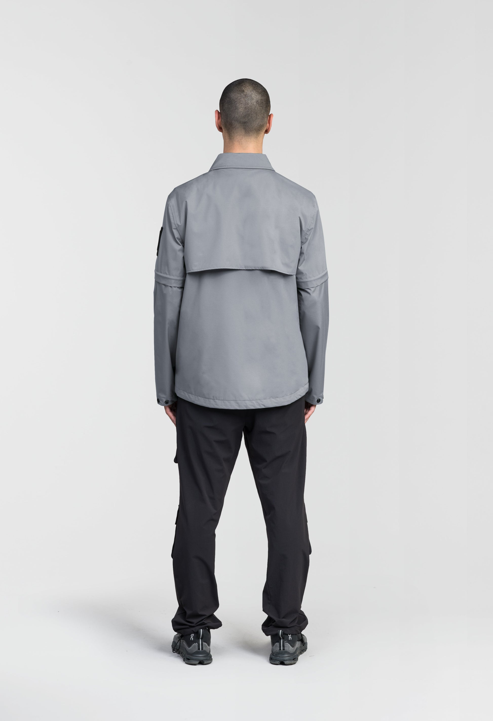 Thurlow Men's Performance Zip Off Sleeve Rain Shirt in hip length, convertible collar, patch chest zipper pockets, hidden in-seam pockets, zip off sleeves, centre front two-way zipper closure, in Concrete