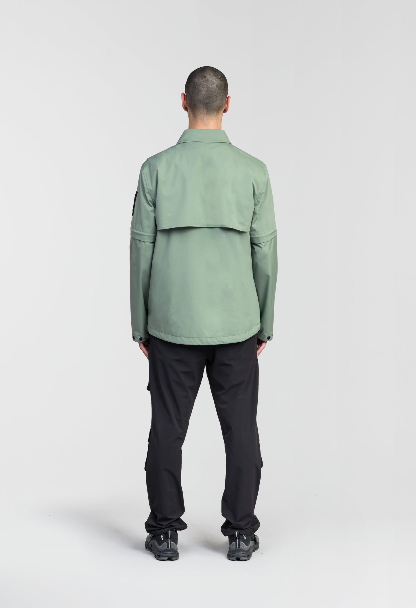 Thurlow Men's Performance Zip Off Sleeve Rain Shirt in hip length, convertible collar, patch chest zipper pockets, hidden in-seam pockets, zip off sleeves, centre front two-way zipper closure, in Duck Green