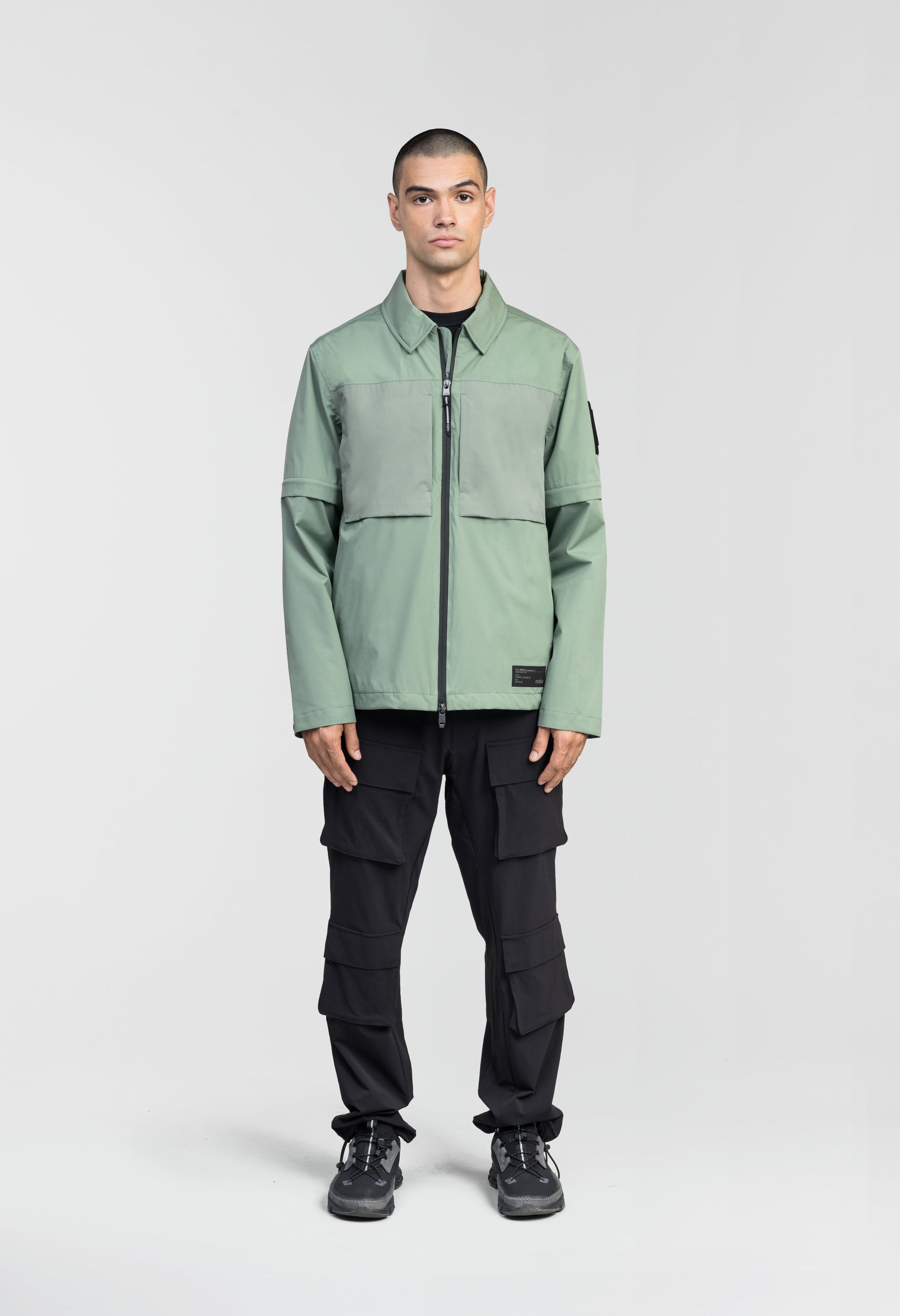 Thurlow Men's Performance Zip Off Sleeve Rain Shirt in hip length, convertible collar, patch chest zipper pockets, hidden in-seam pockets, zip off sleeves, centre front two-way zipper closure, in Duck Green