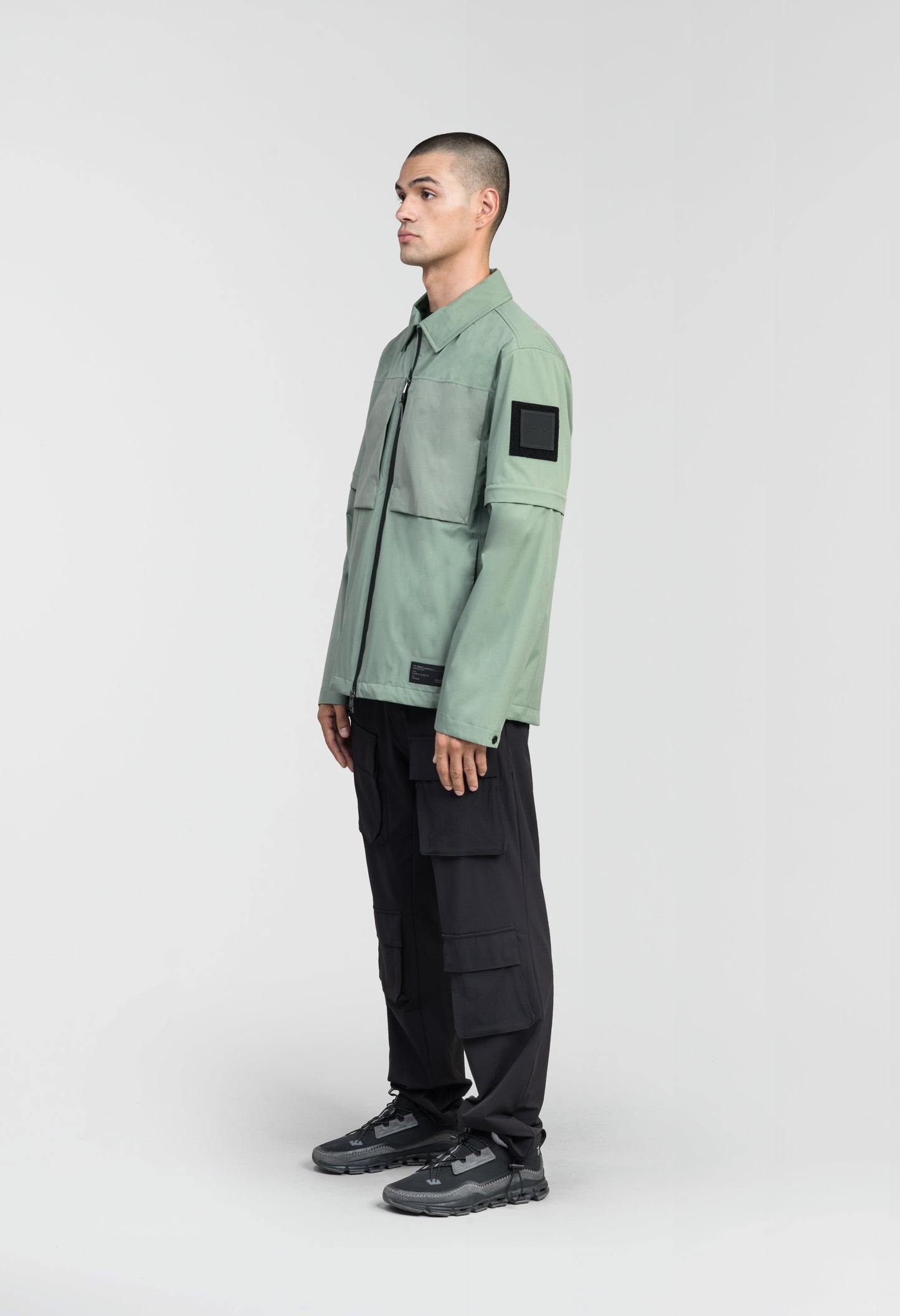 Thurlow Men's Performance Zip Off Sleeve Rain Shirt in hip length, convertible collar, patch chest zipper pockets, hidden in-seam pockets, zip off sleeves, centre front two-way zipper closure, in Duck Green