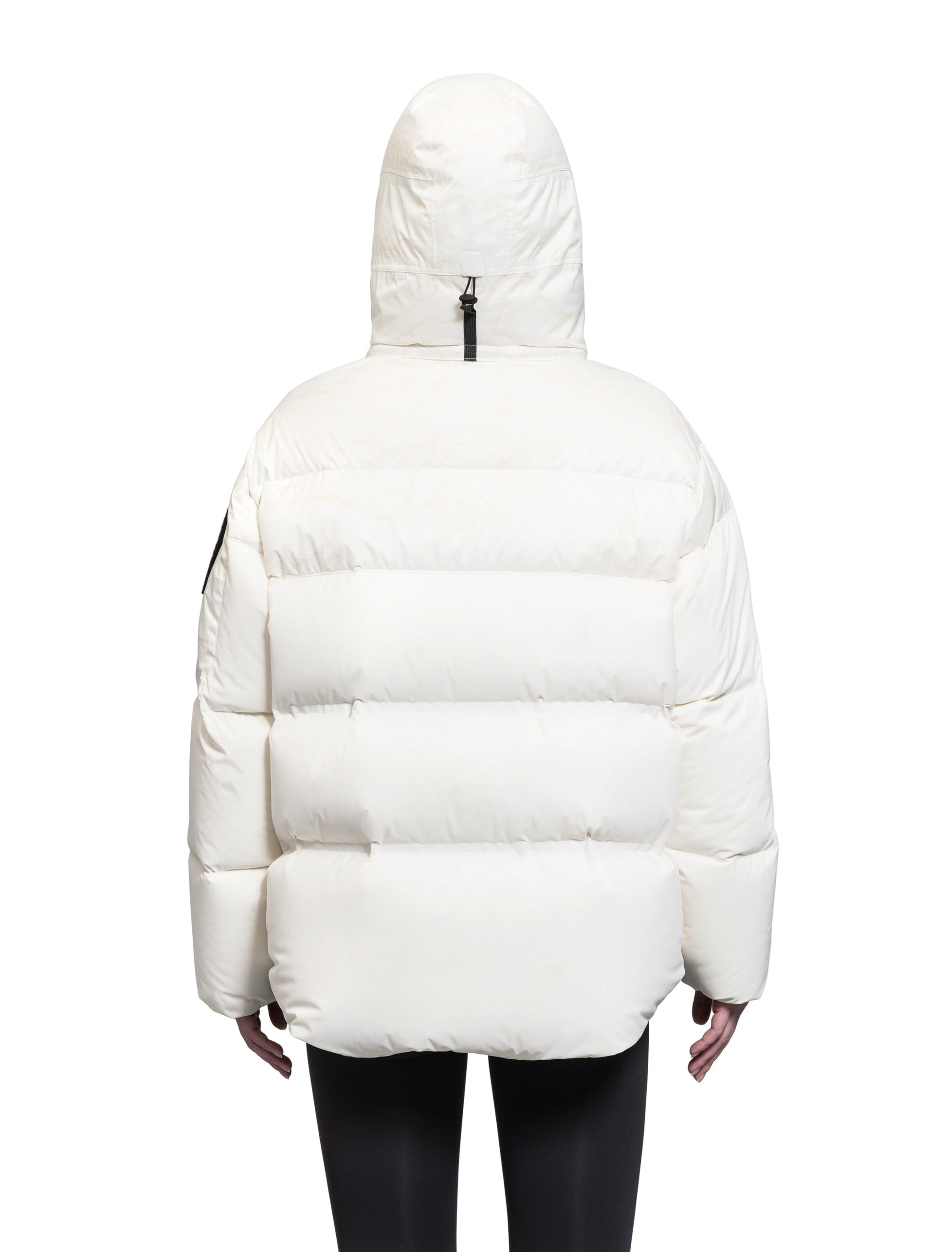 Una Ladies Performance Puffer in hip length, Technical Taffeta and Durable Stretch Ripstop fabrication, Premium Canadian White Duck Down insulation, removable down filled hood, centre front two-way zipper, and side-entry pockets at waist, in Wheat Desert