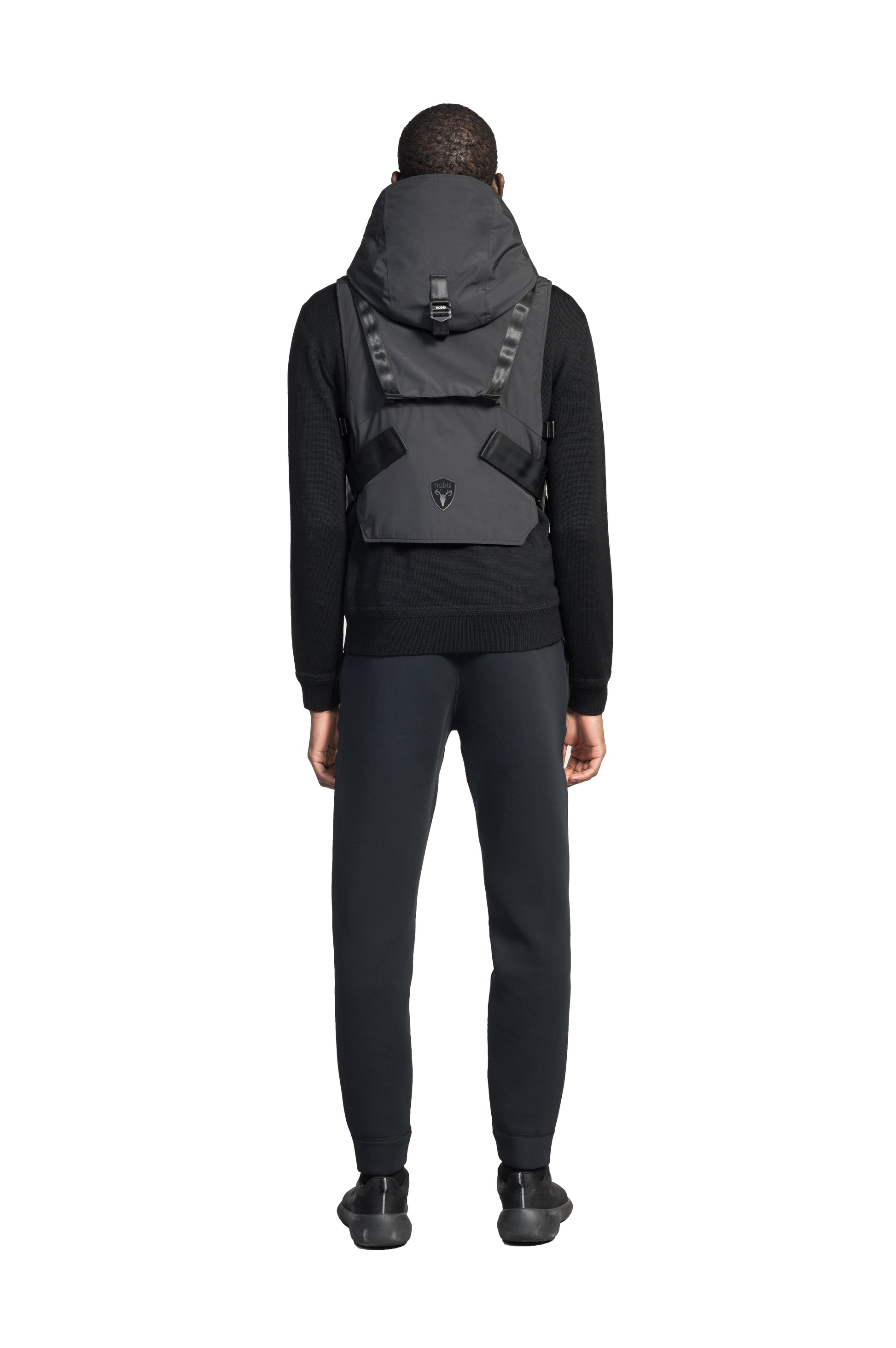 Vulcan Unisex Tactical Vest in waist length, Primaloft Gold Insulation Active, non-removable hood, removable face mask, seven pockets on front and back, and two-way front zipper, in Black