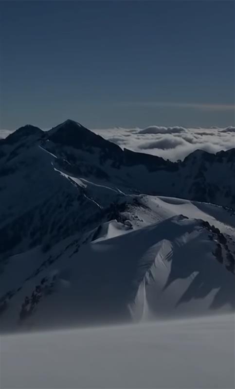 Snowy mountain peaks with a clear sky