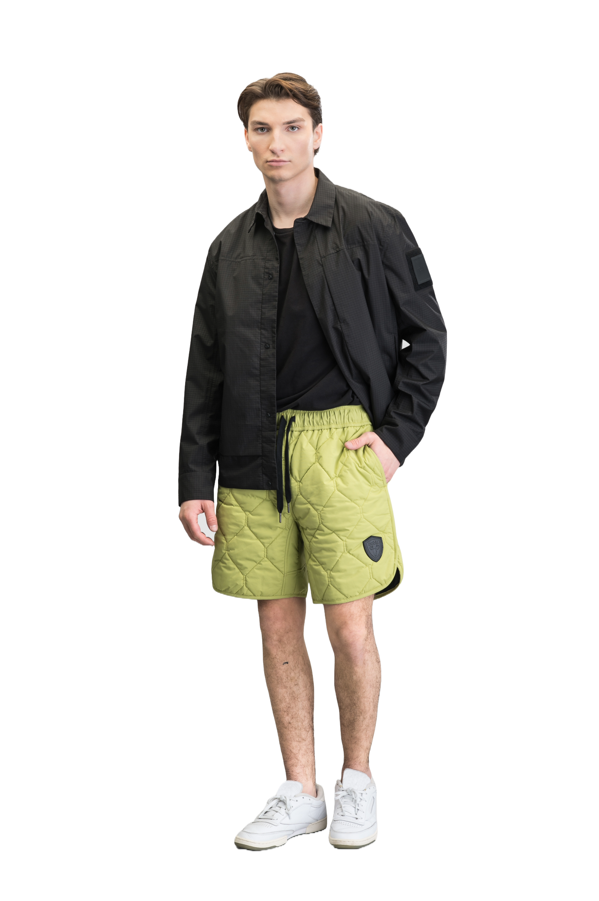 Curt Men's Performance Quilted Shorts at knee length, premium stretch nylon and stretch ripstop fabricaiton, premium 4-way stretch, water resistant Primaloft Gold Insulation Active+, side seam pockets, exteriror back pocket, elasticized waist with drawcords, and notch detailing at side seams, in Dark Citron