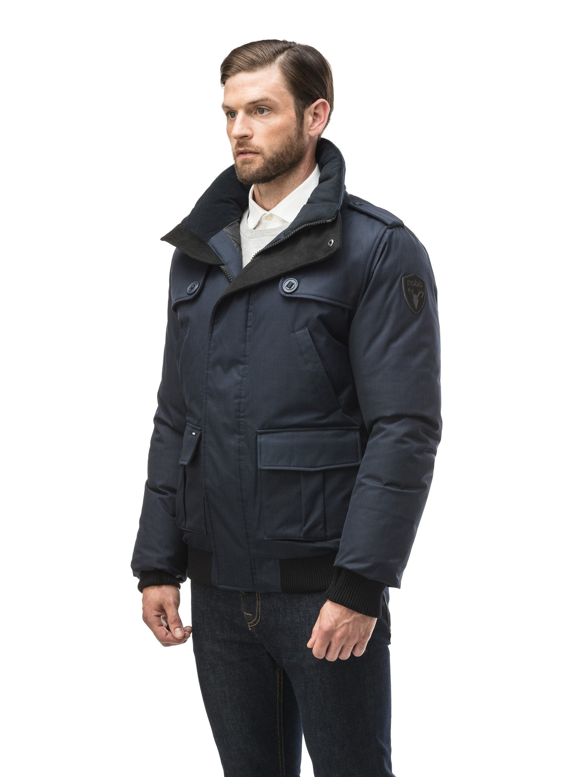 Men's down filled bomber that sits just above the hips with a completely removable hood that's windproof, waterproof, and breathable in CH Navy