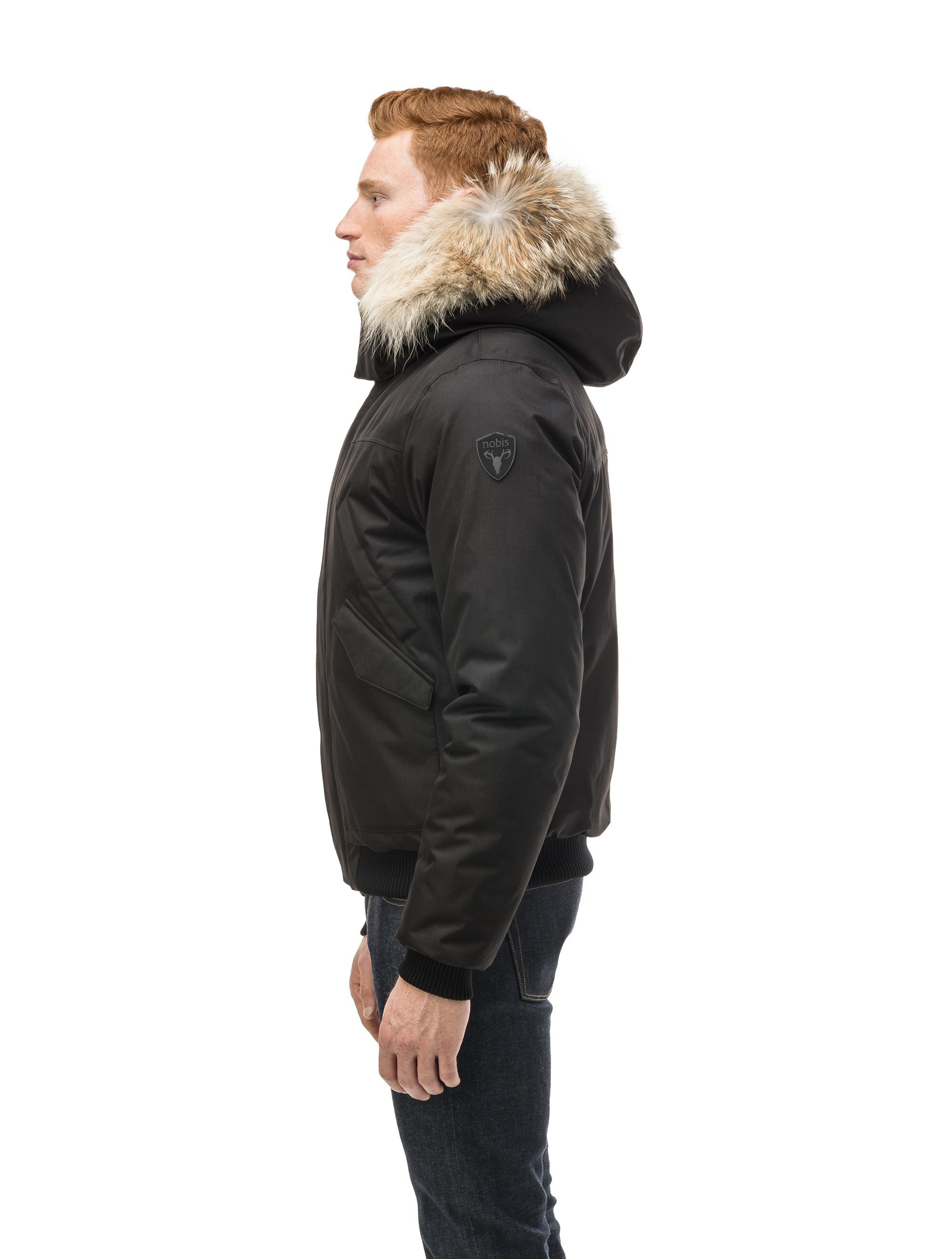 Men's classic down filled bomber jacket with a down filledÃ‚Â hood that features a removable coyote fur trim and concealed moldable framing wire in Black