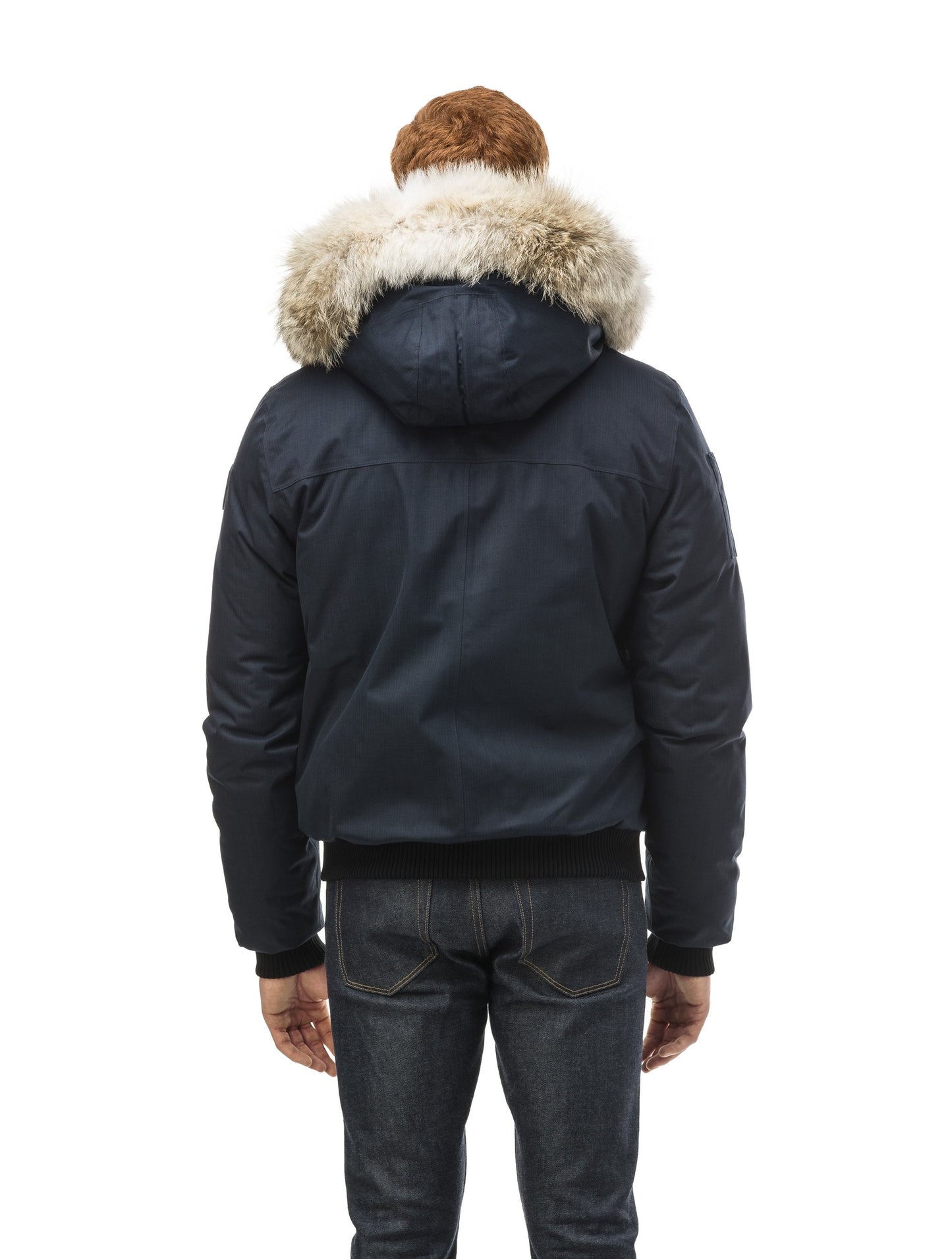 Men's classic down filled bomber jacket with a down filledÃ‚Â hood that features a removable coyote fur trim and concealed moldable framing wire in Navy