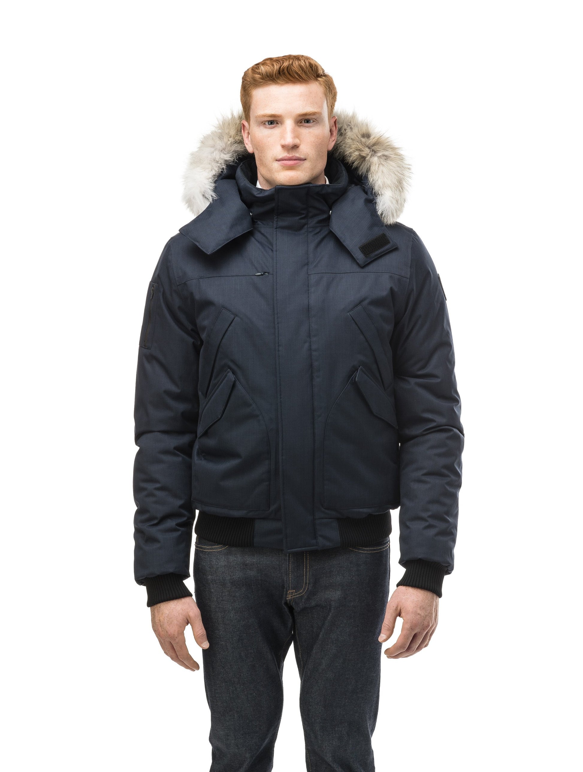 Men's classic down filled bomber jacket with a down filledÃ‚Â hood that features a removable coyote fur trim and concealed moldable framing wire in Navy
